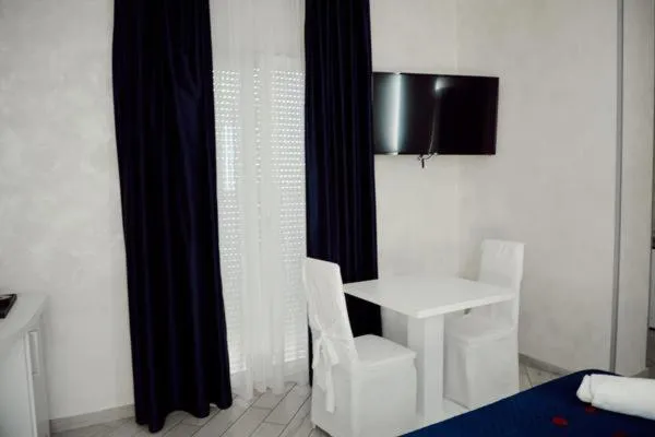 Seating area, Bed in BlueBay Residence Resort