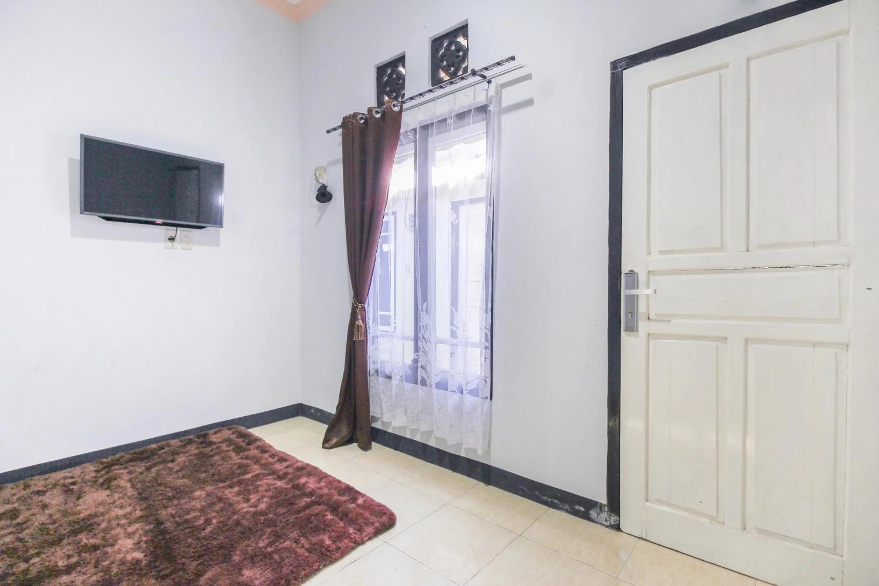 Bedroom in OYO 3399 Gea Guest House