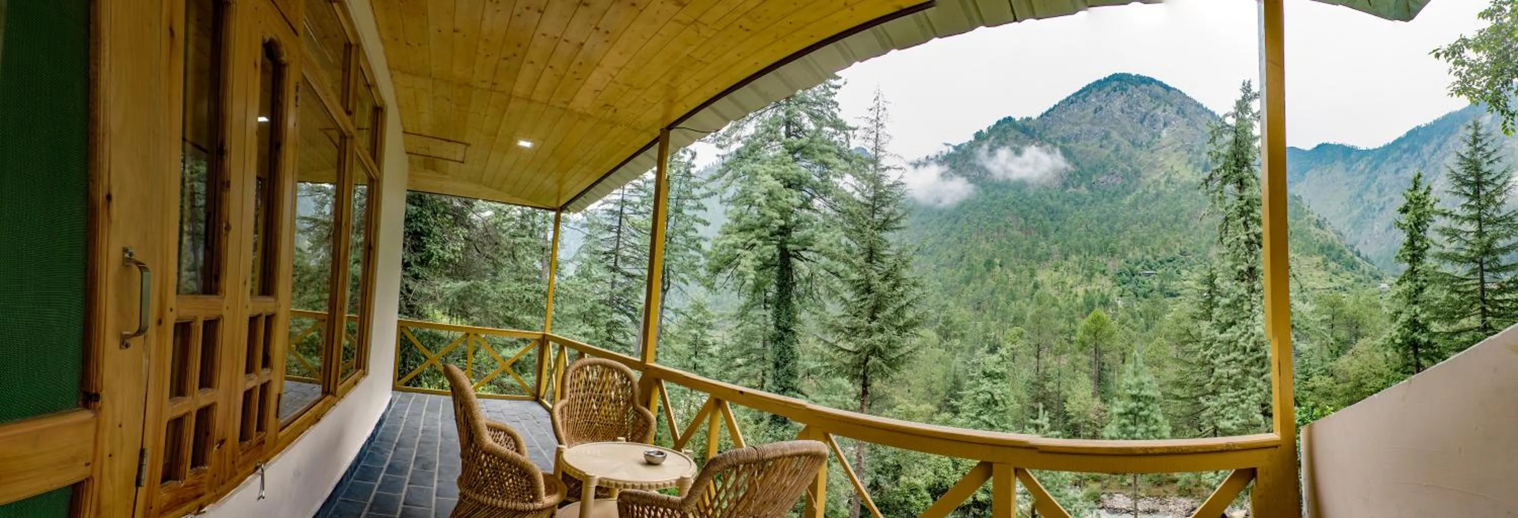 Bed in Parvati Kuteer riverside resort