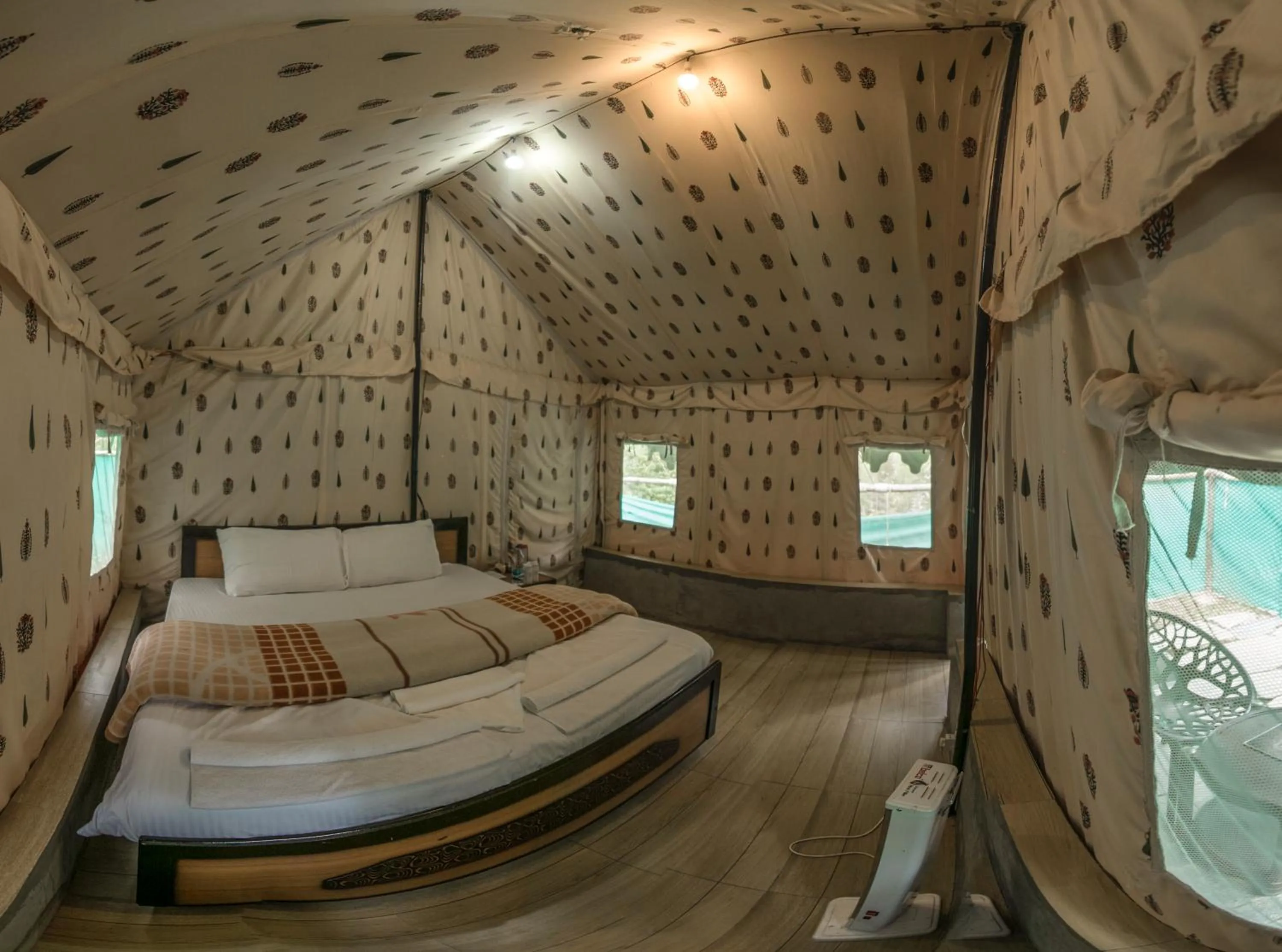 Bed in Parvati Kuteer riverside resort