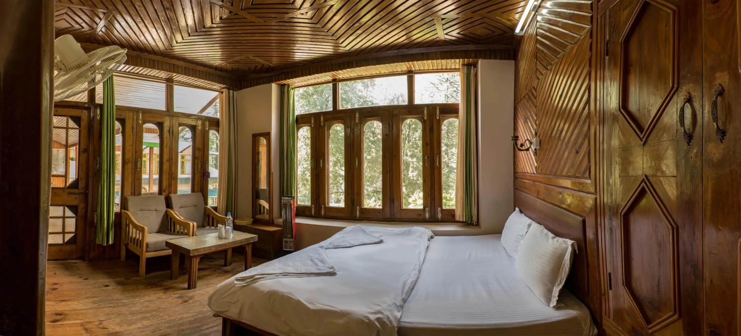 Bed in Parvati Kuteer riverside resort