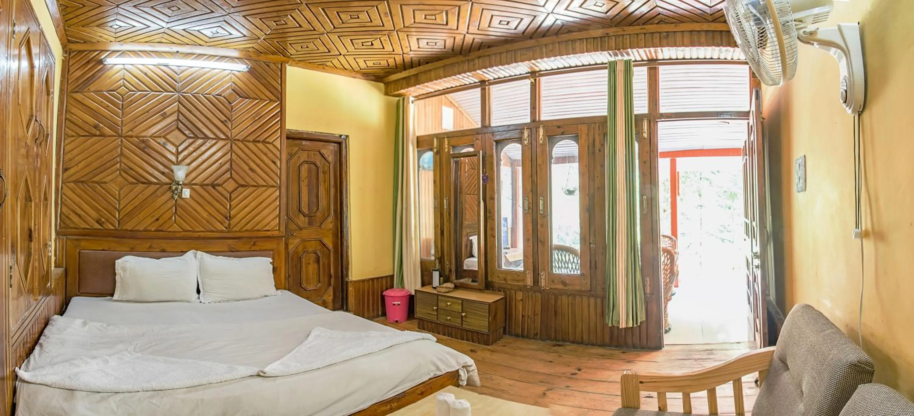 Bed in Parvati Kuteer riverside resort