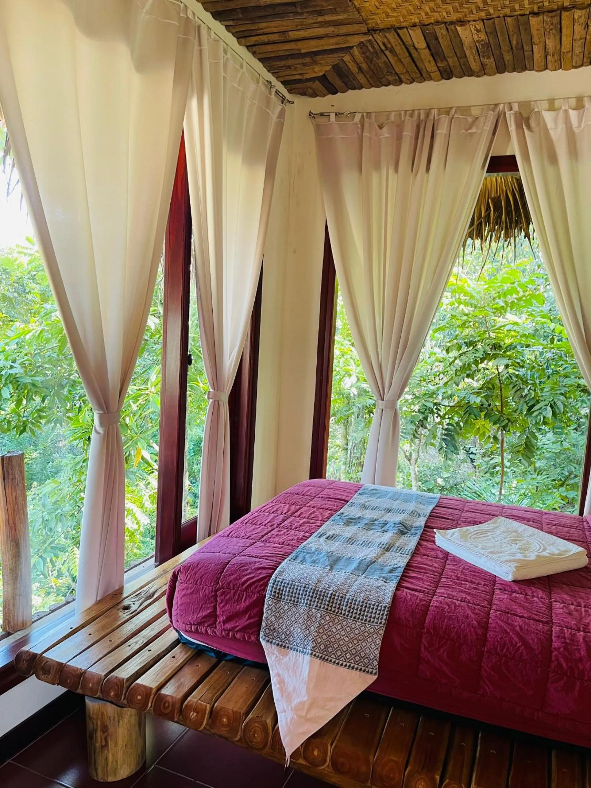 Bed in Pu Luong Jungle Lodge