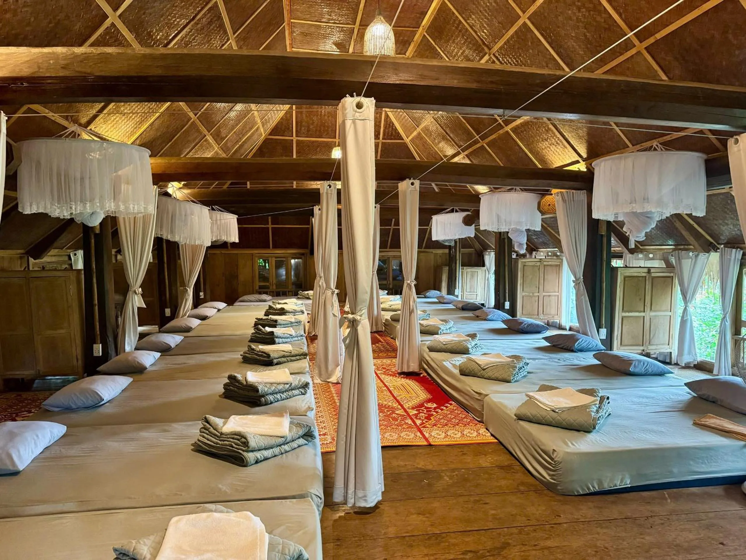 Bed in Pu Luong Jungle Lodge