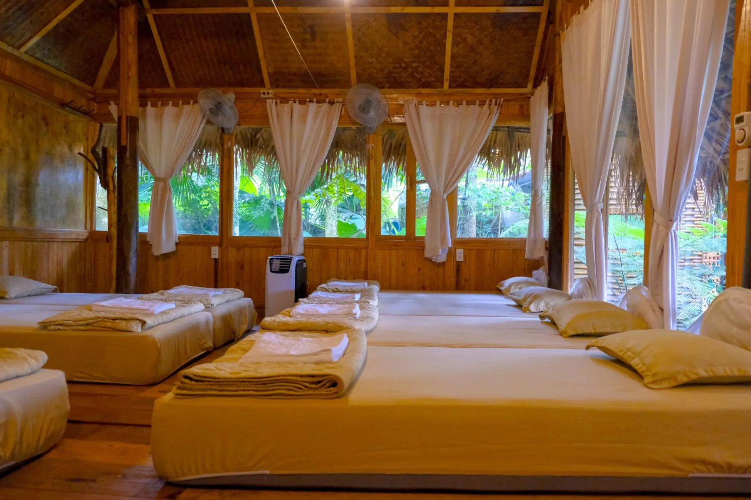 Bed in Pu Luong Jungle Lodge