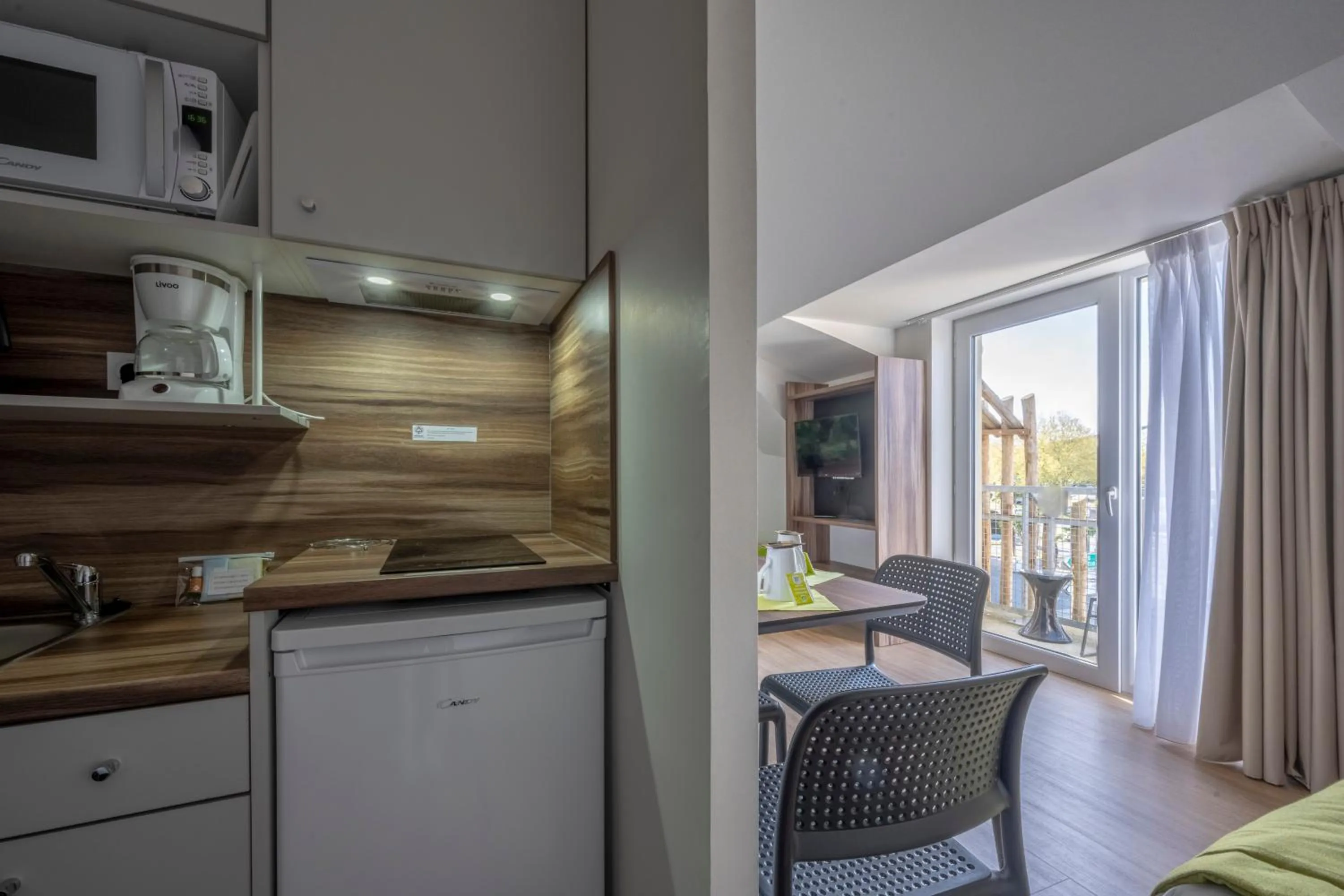 Kitchen or kitchenette in ATHOME RESIDENCE ET SPA