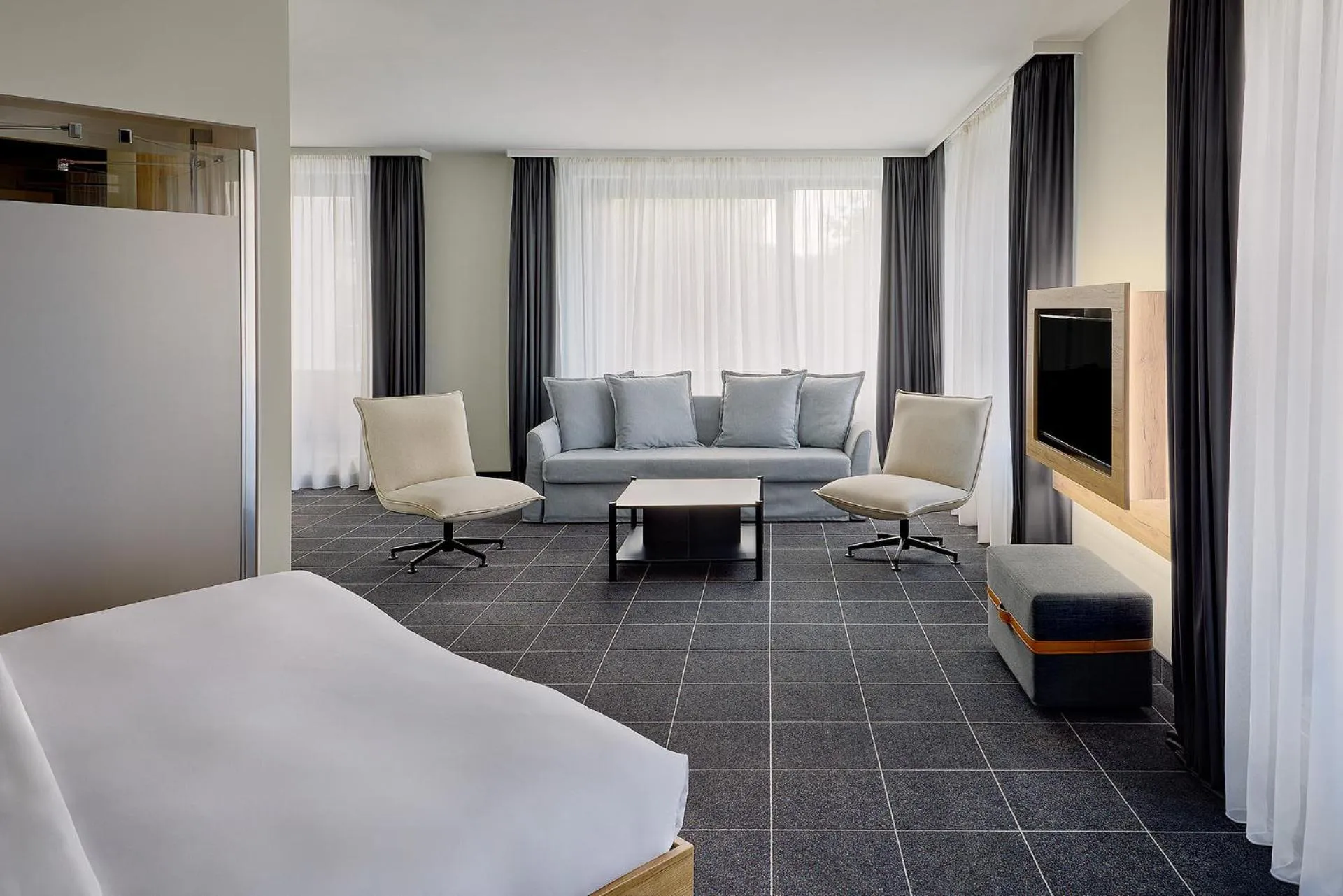 Living room, Bed in Four Points Flex by Sheraton Ratingen Düsseldorf Airport