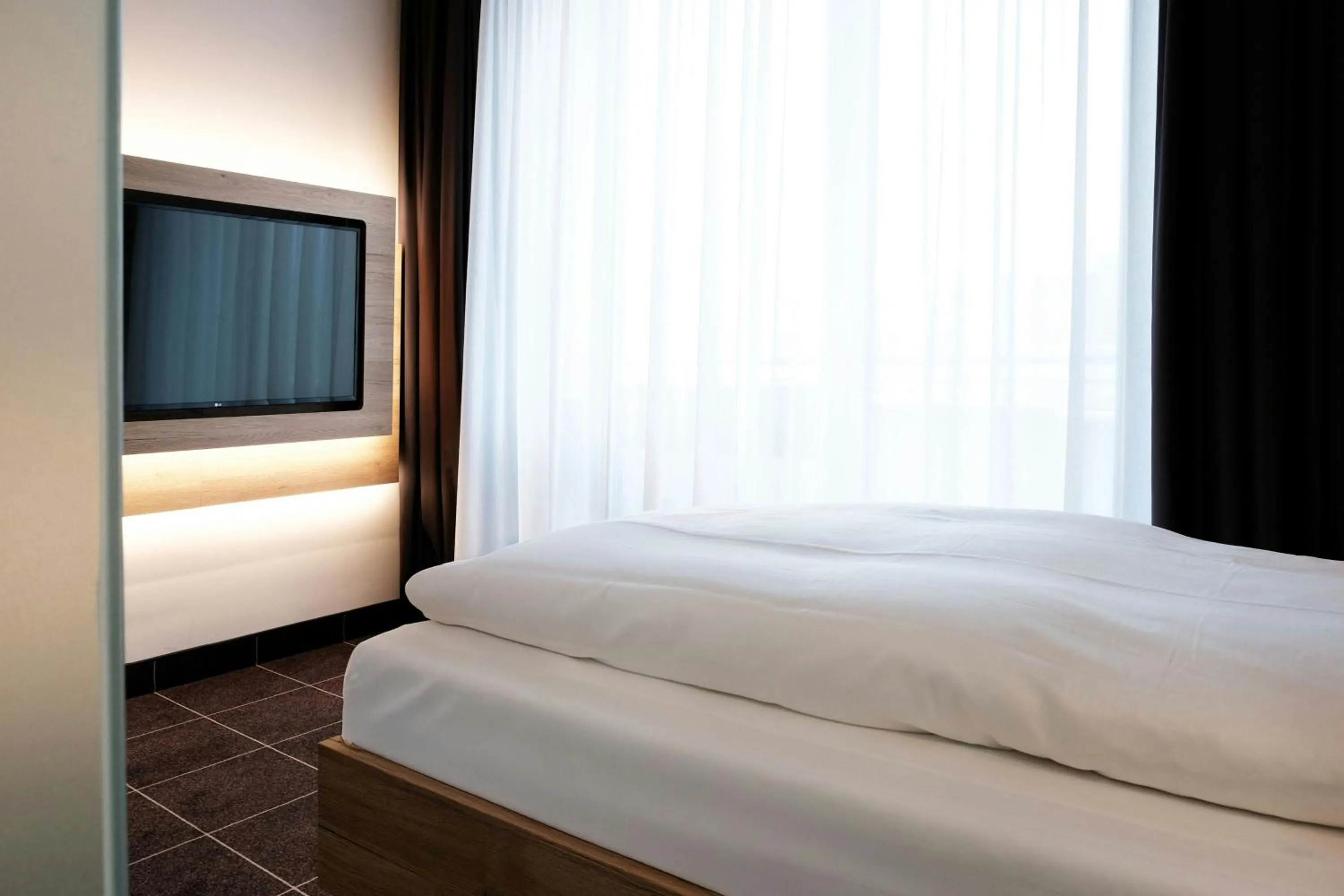 Photo of the whole room, Bed in Four Points Flex by Sheraton Ratingen Düsseldorf Airport