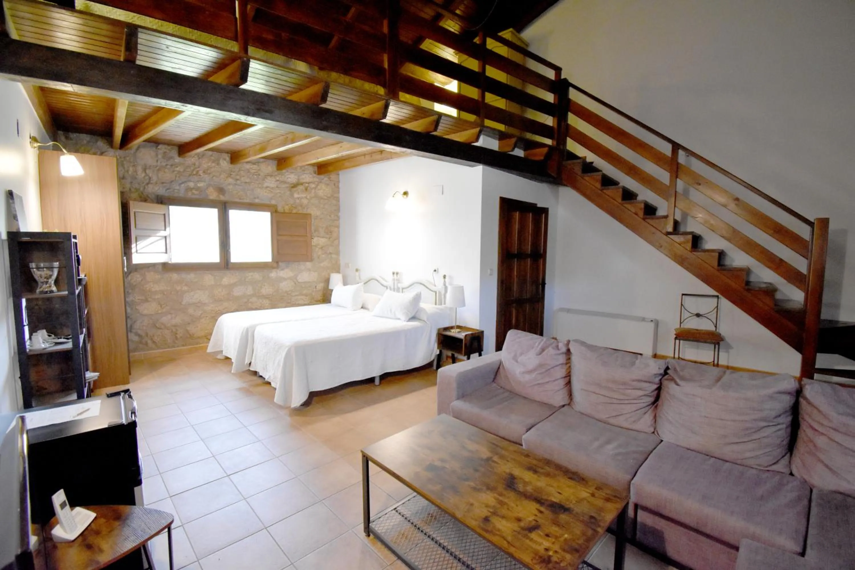 Living room, Bed in HOTEL RURAL A VELHA FABRICA