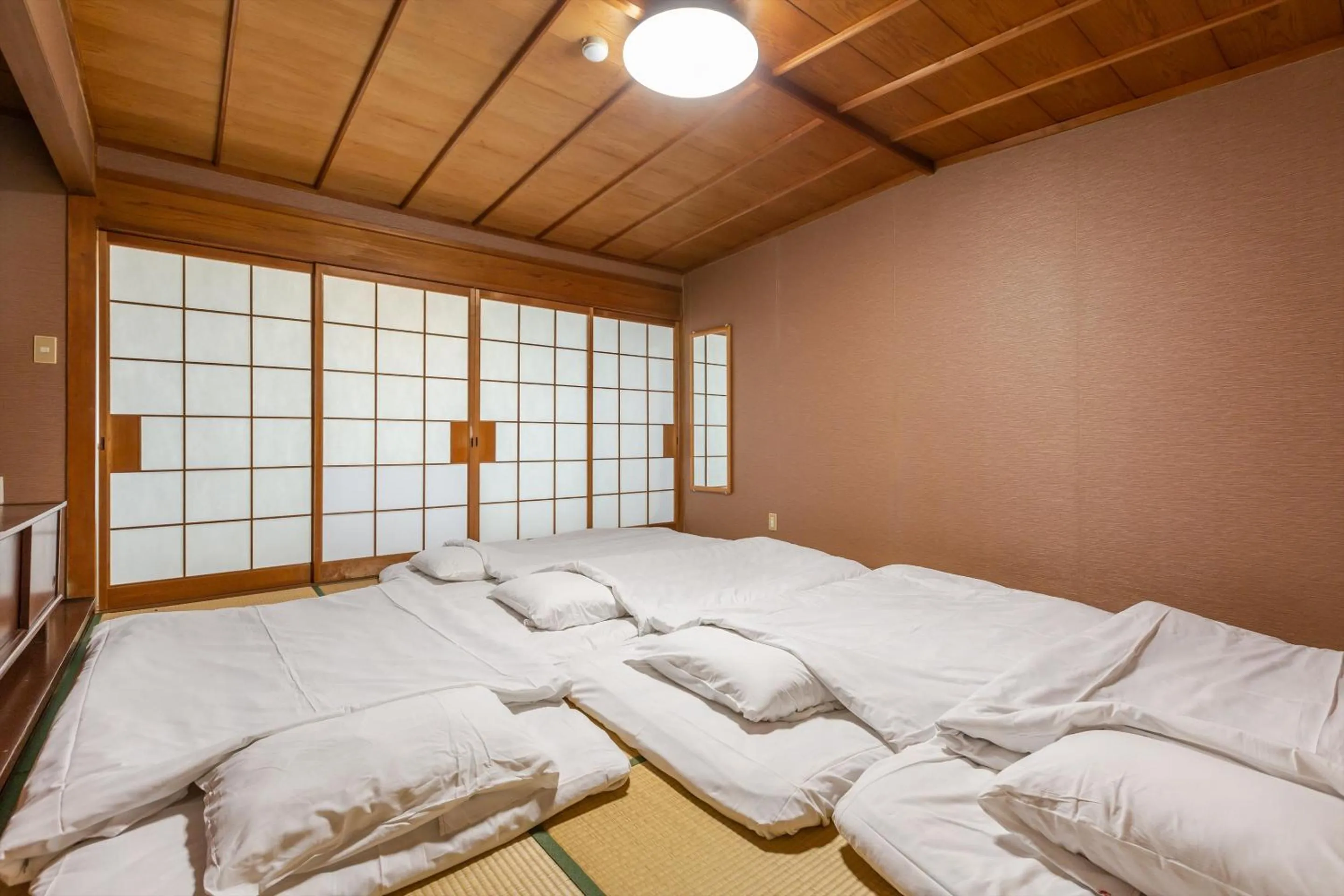 Bed in Tabist Spa Yubara Okayama Yubaraonsen