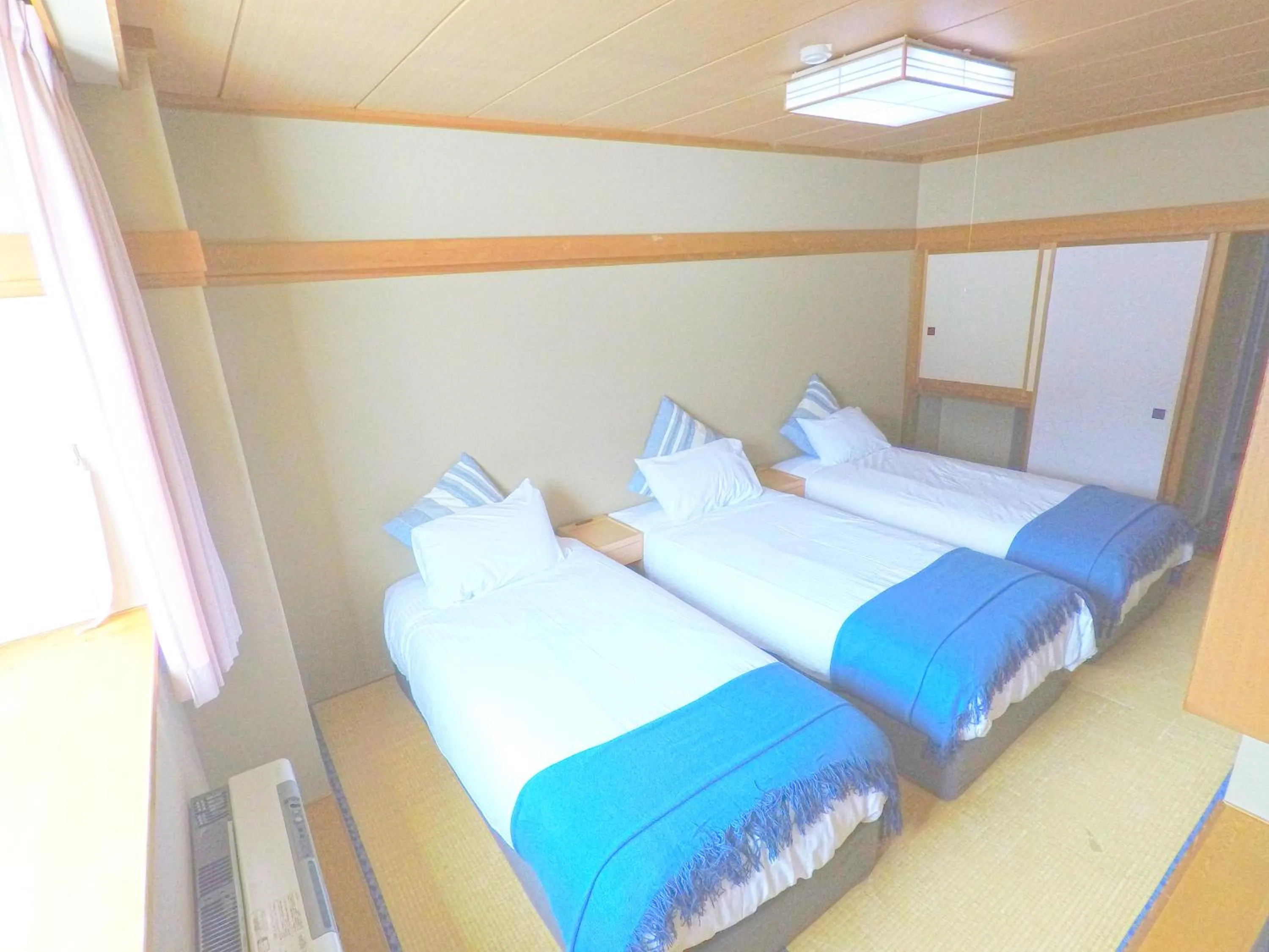 Bed in Red Fox Lodge Myoko