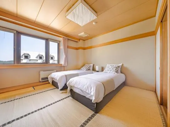 Bed in Red Fox Lodge Myoko