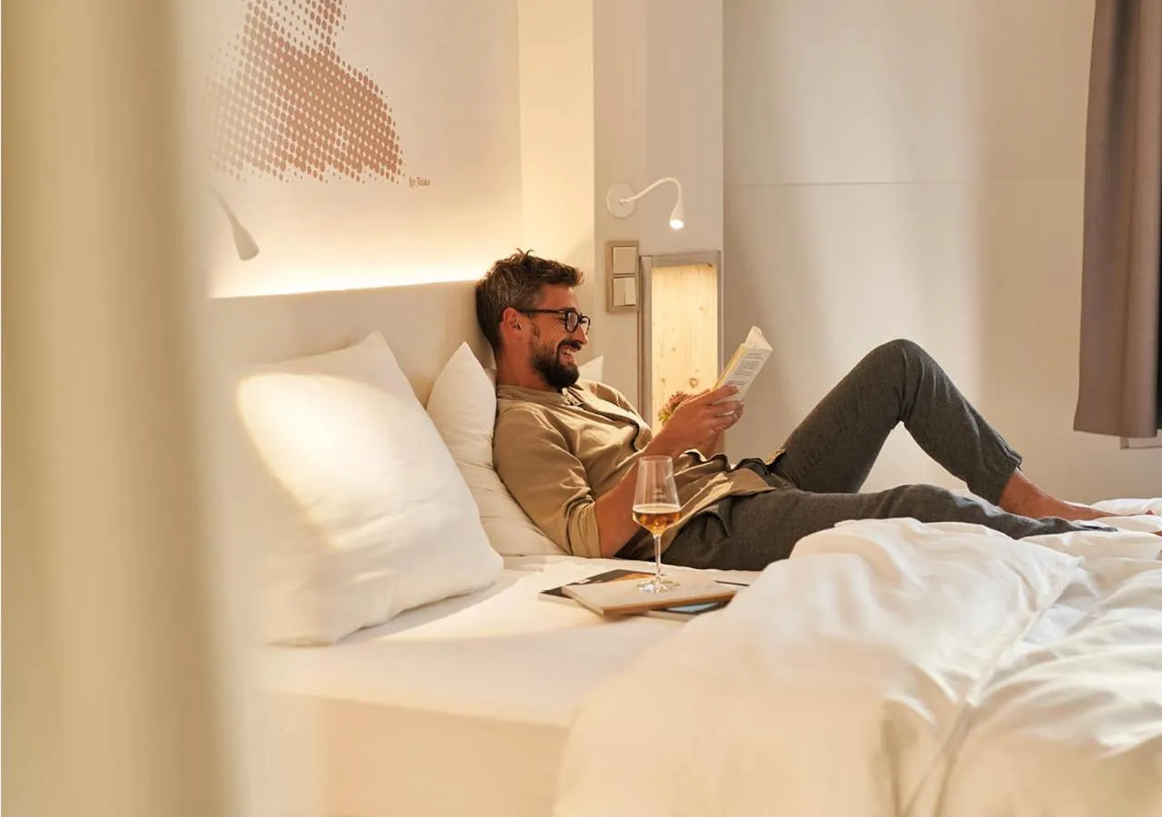 Photo of the whole room, Bed in SEETELHOTEL Strandhotel Atlantic das Boutiquehotel am Meer