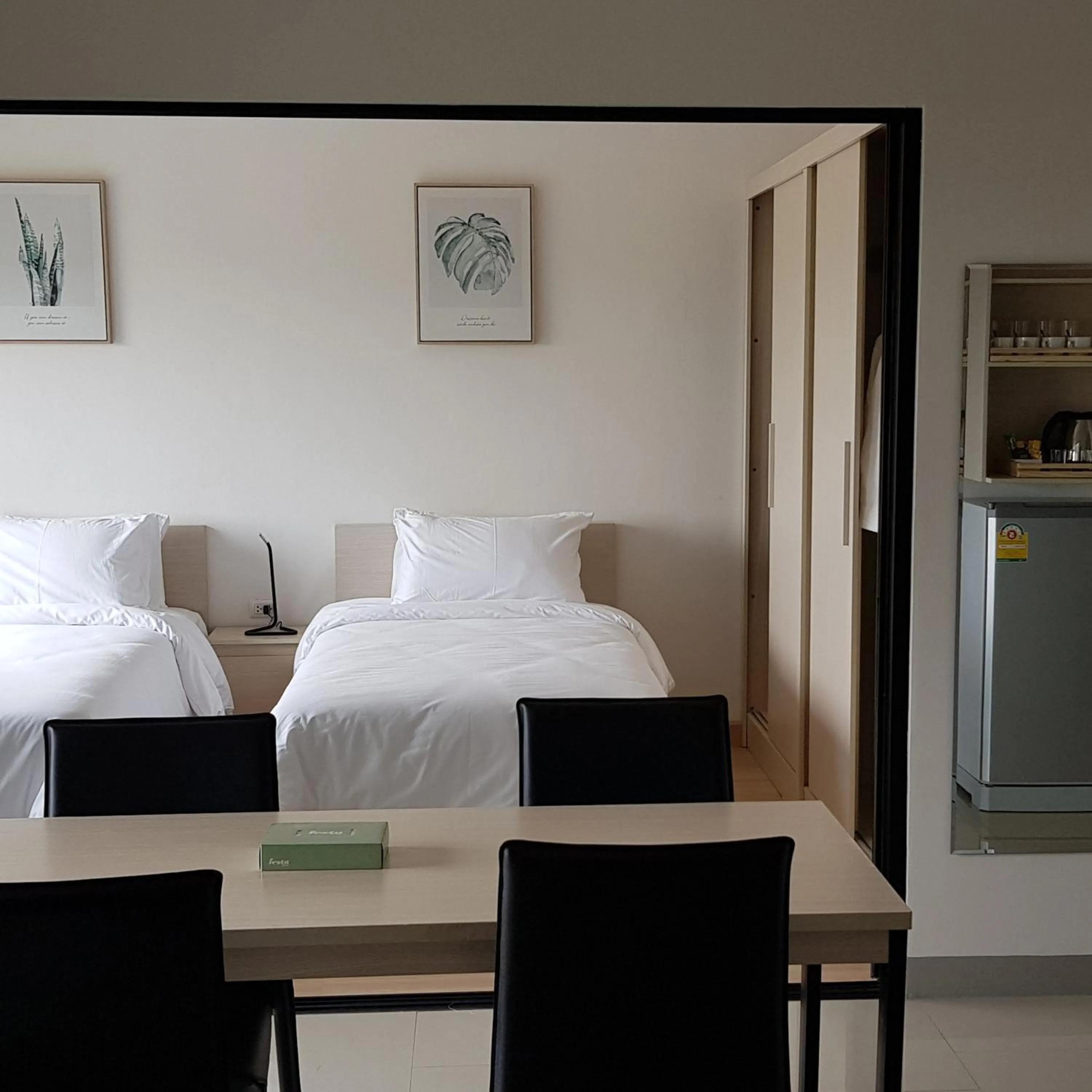 Photo of the whole room, Bed in KOS Hotel Suvarnabhumi Airport -SHA Extra Plus