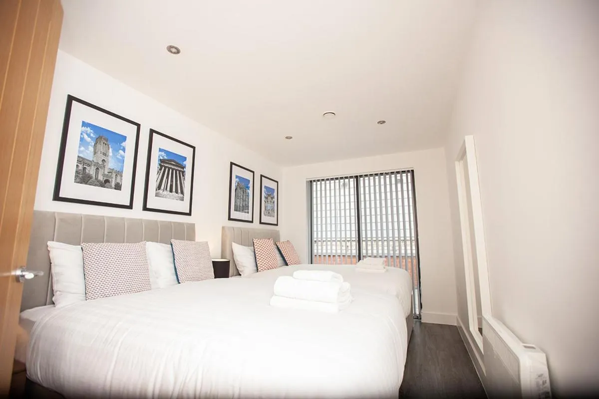 Bed in SGT Peppers Mathew Street Apartments By Happy Days