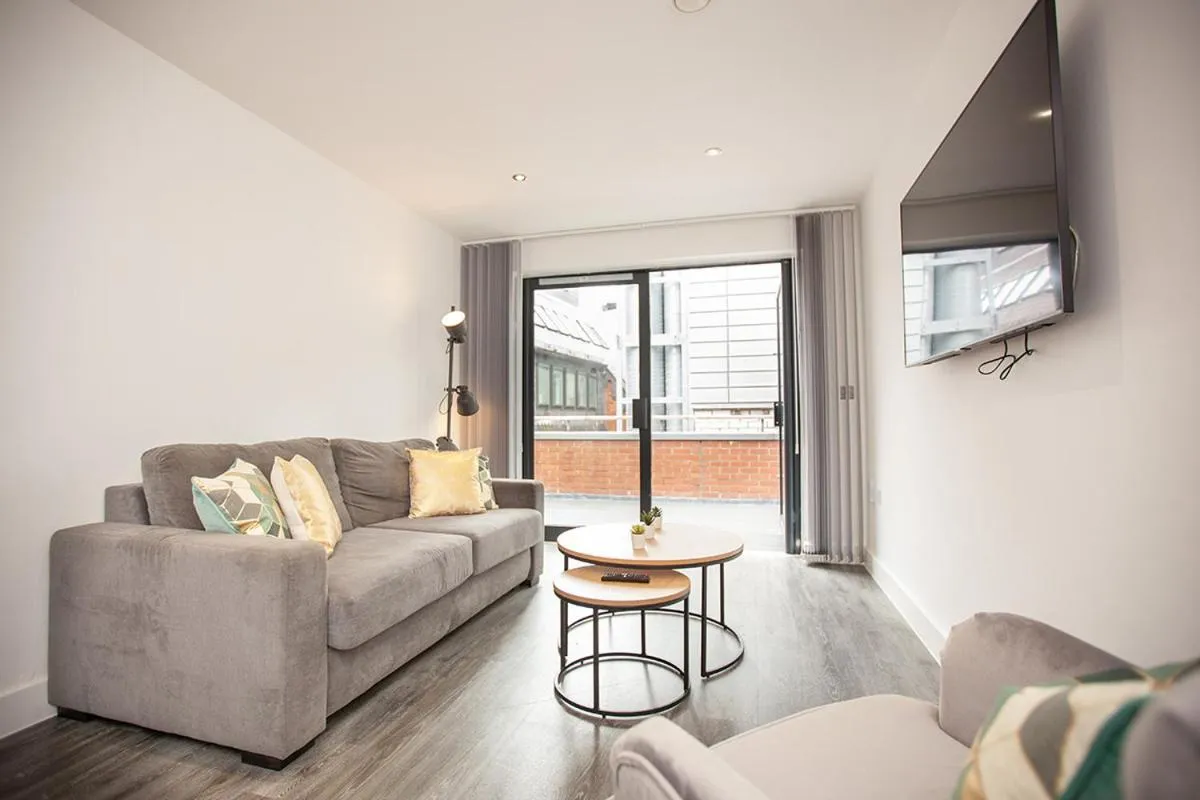 Living room in SGT Peppers Mathew Street Apartments By Happy Days