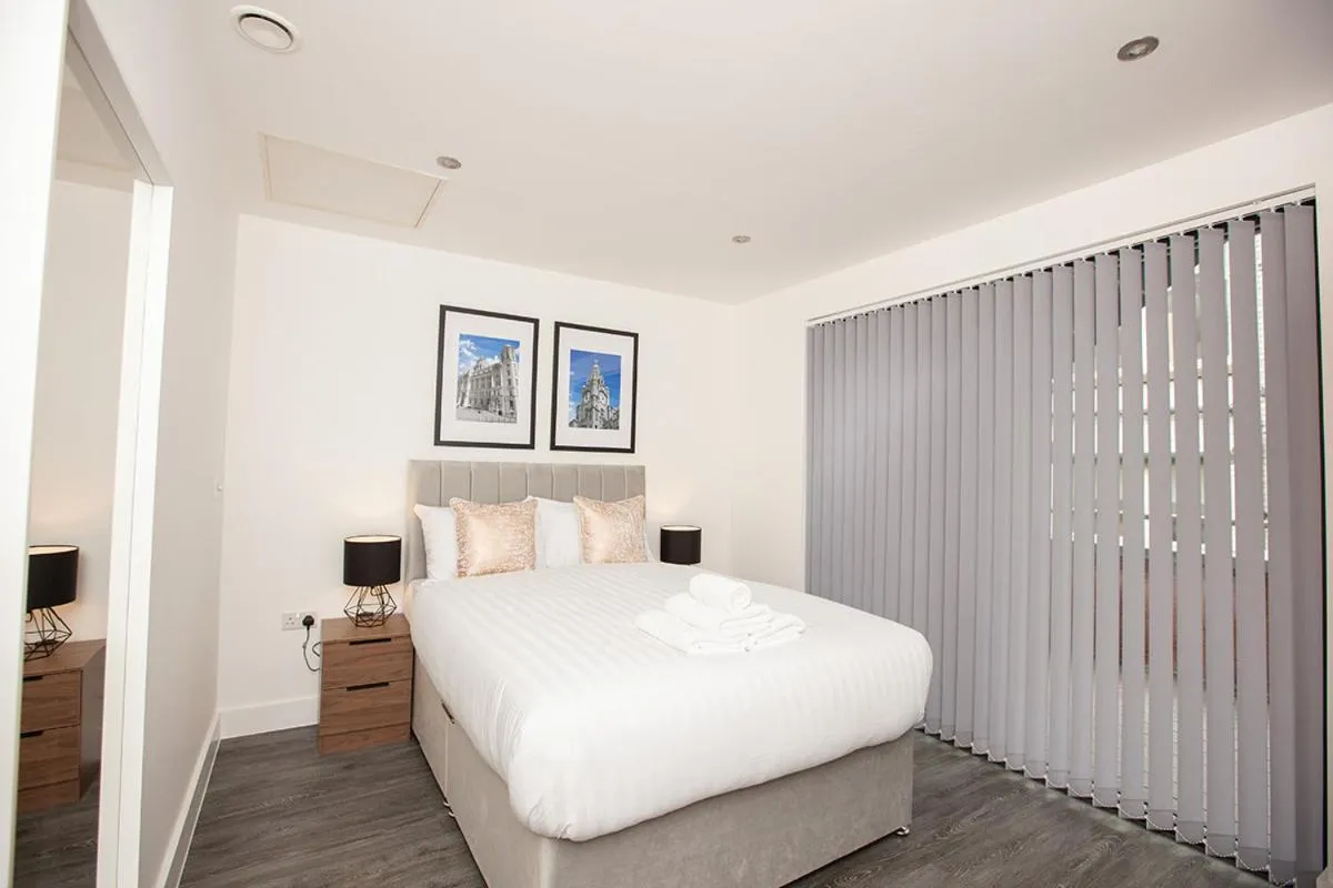 Bed in SGT Peppers Mathew Street Apartments By Happy Days