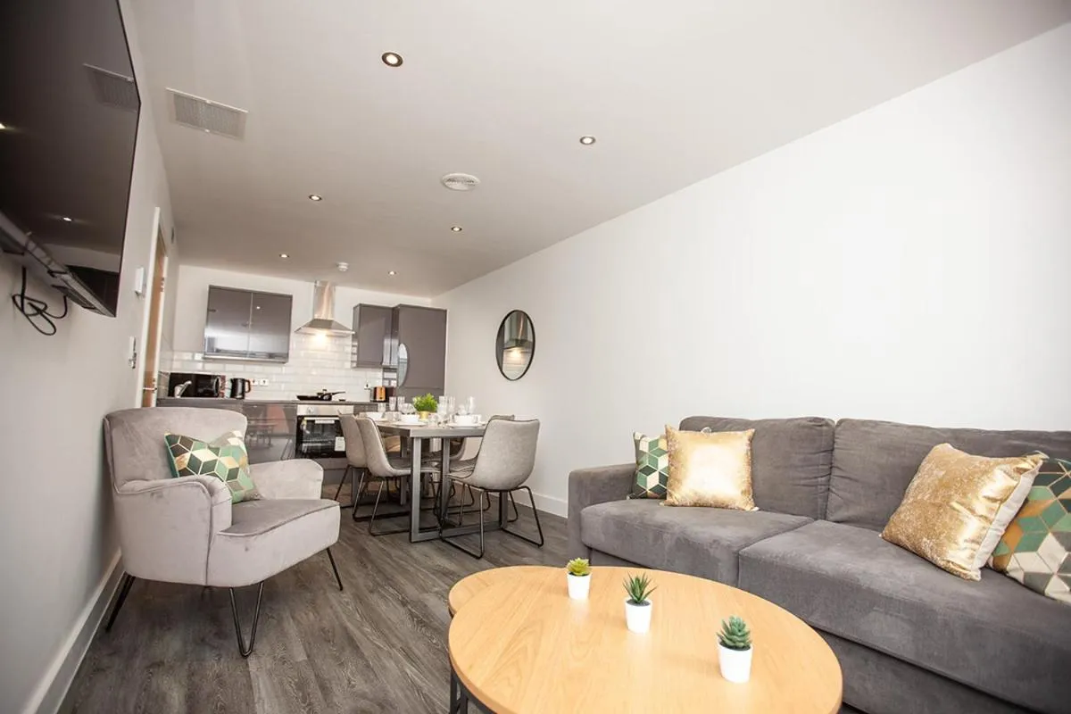 Living room in SGT Peppers Mathew Street Apartments By Happy Days