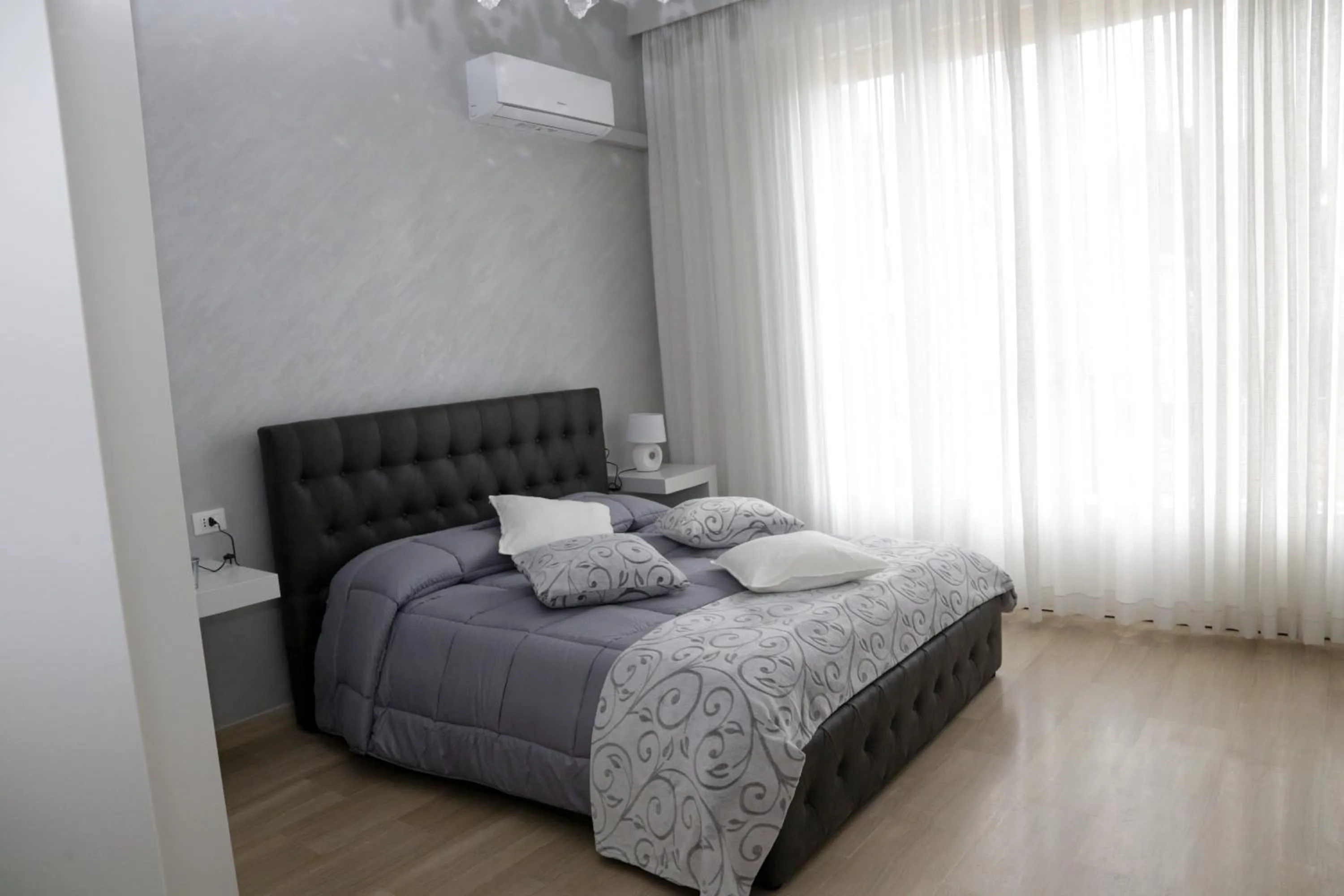 Bed in Ad Astra Rooms