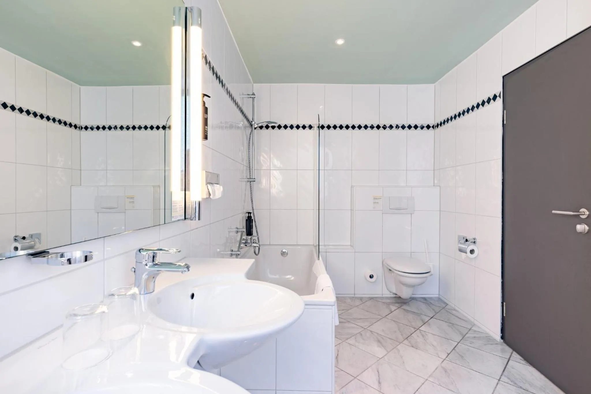 Bathroom in Garner Hotel Cologne East by IHG