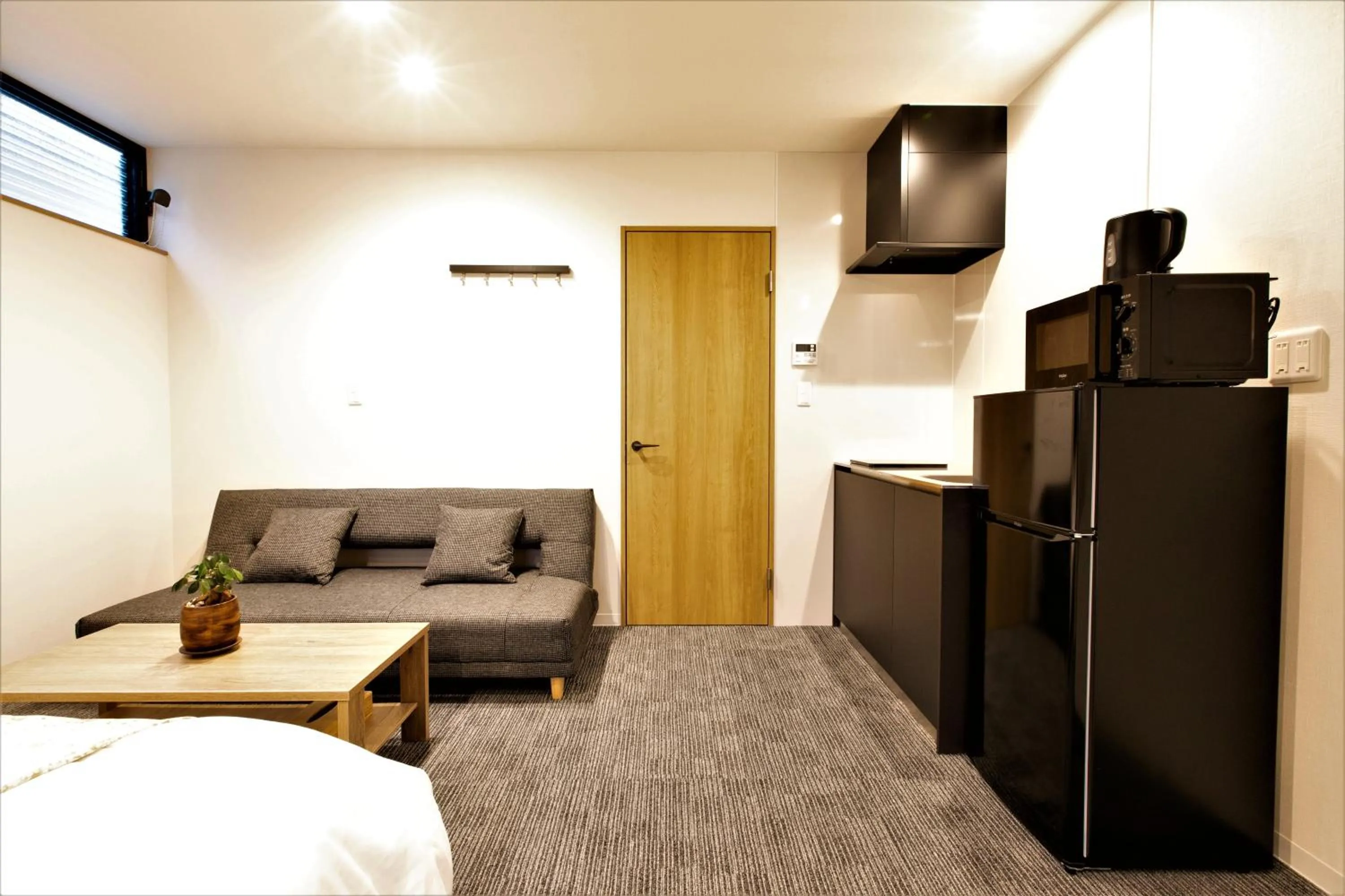 Living room, Bed in Apartment Hotel STAY THE Kansai Airport
