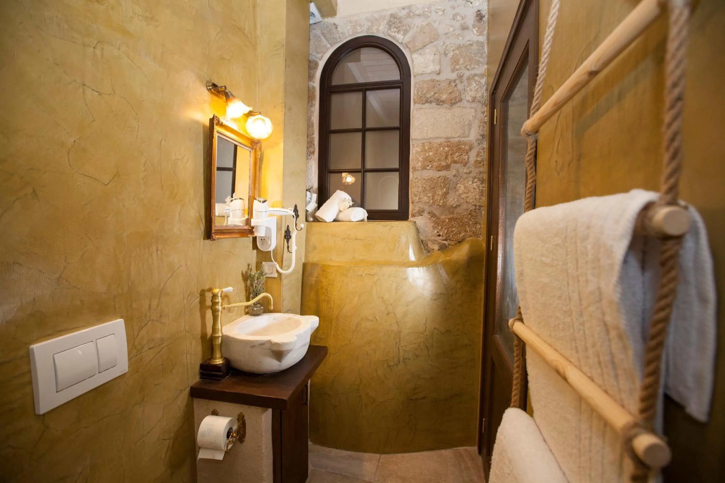 Bathroom in Porolithos Boutique Hotel