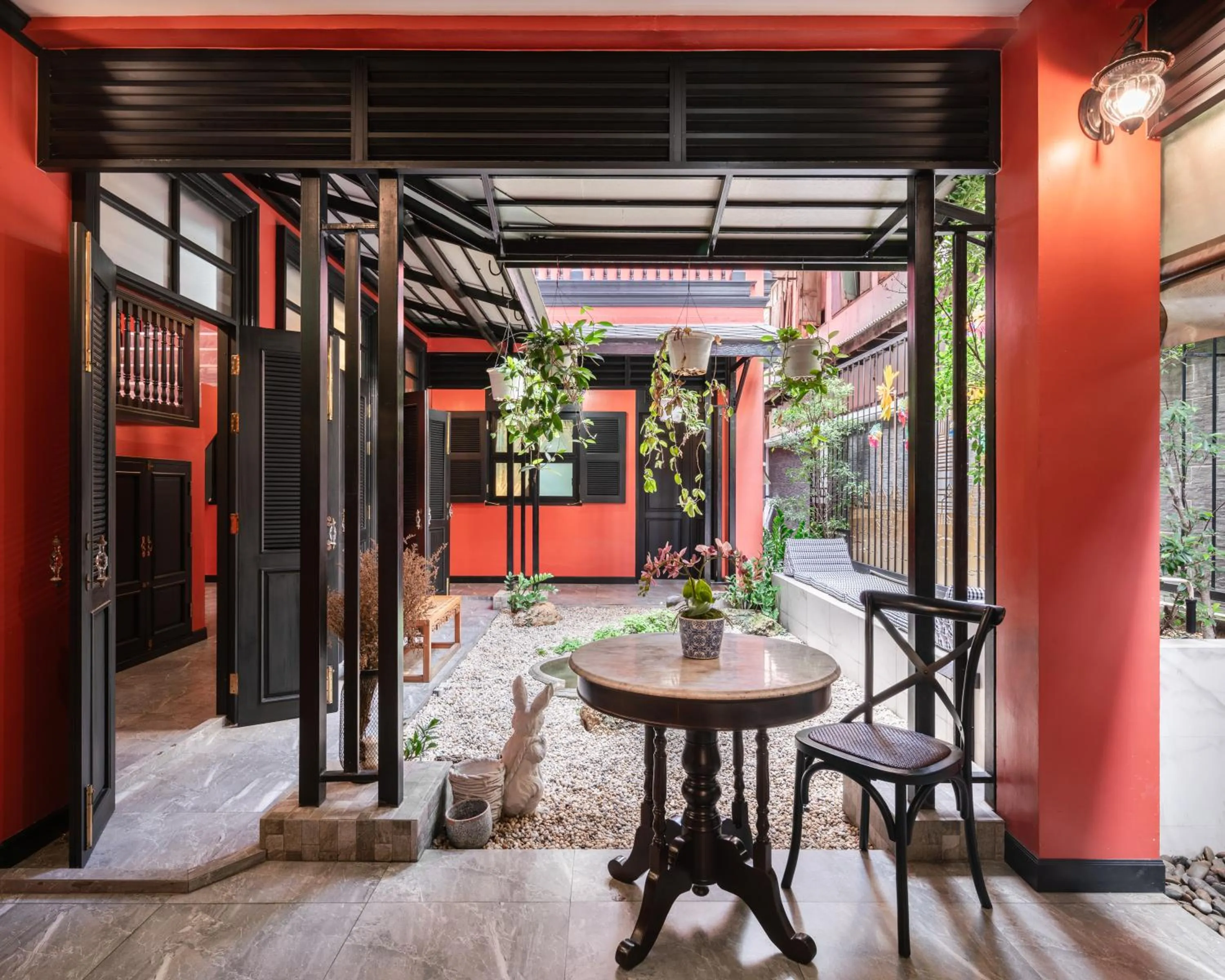 Seating area in DE Phanakron Boutique Hotel