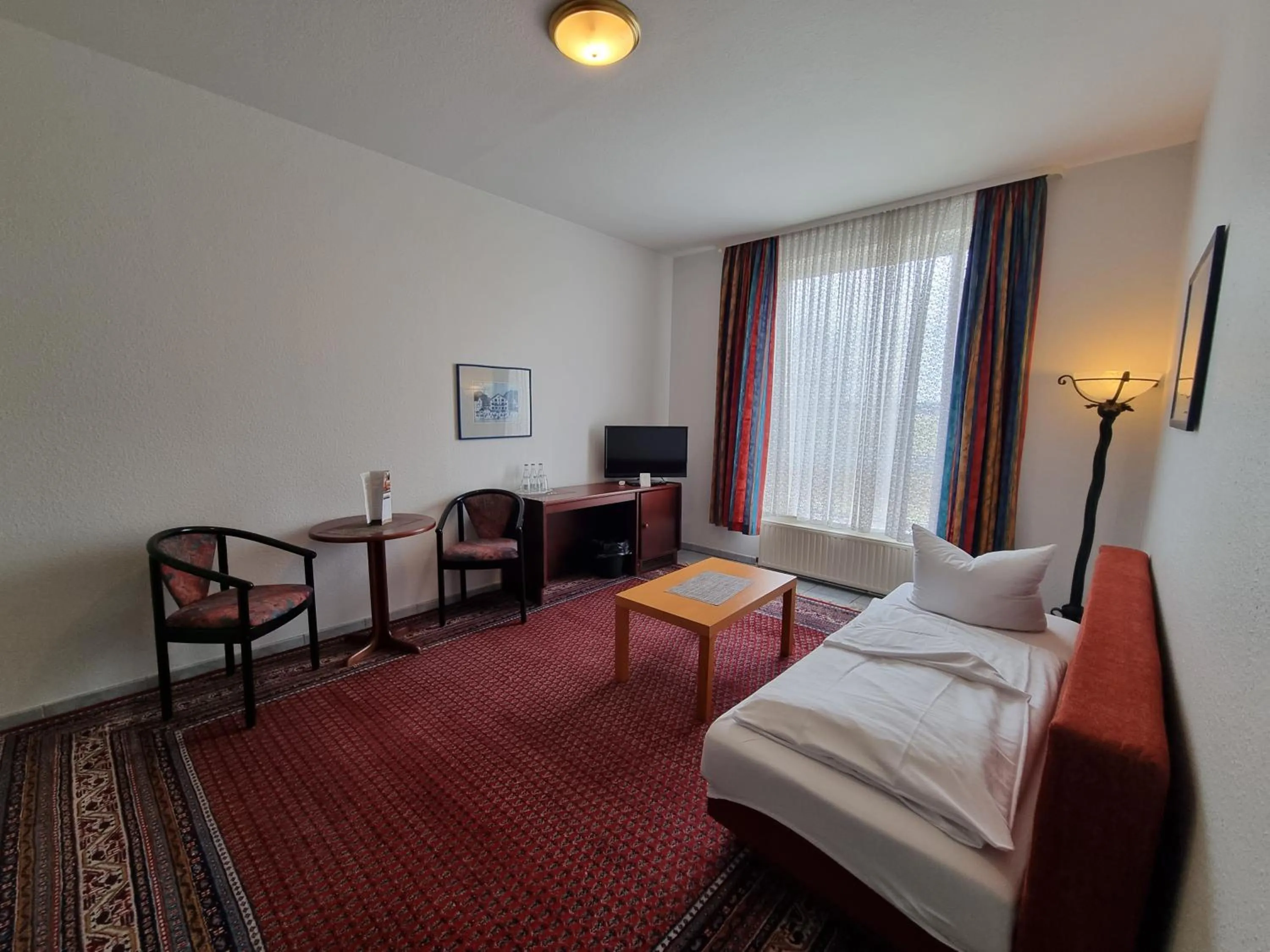 Living room, Bed in Erbenholz Hotel