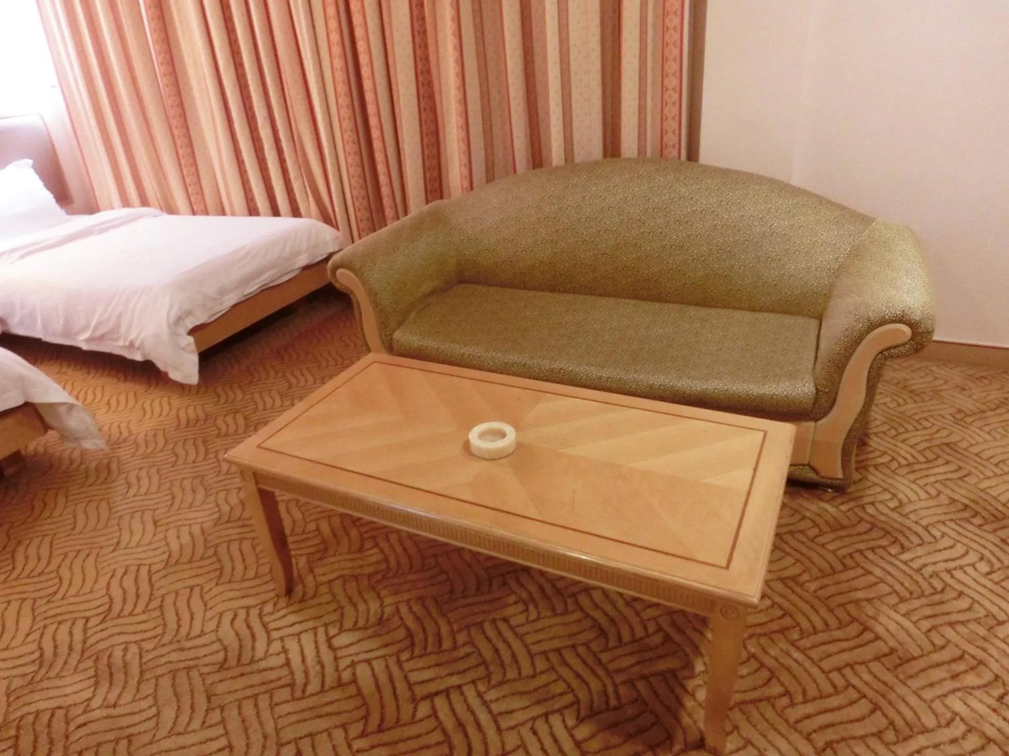 Seating area, Bed in New Asia Hotel