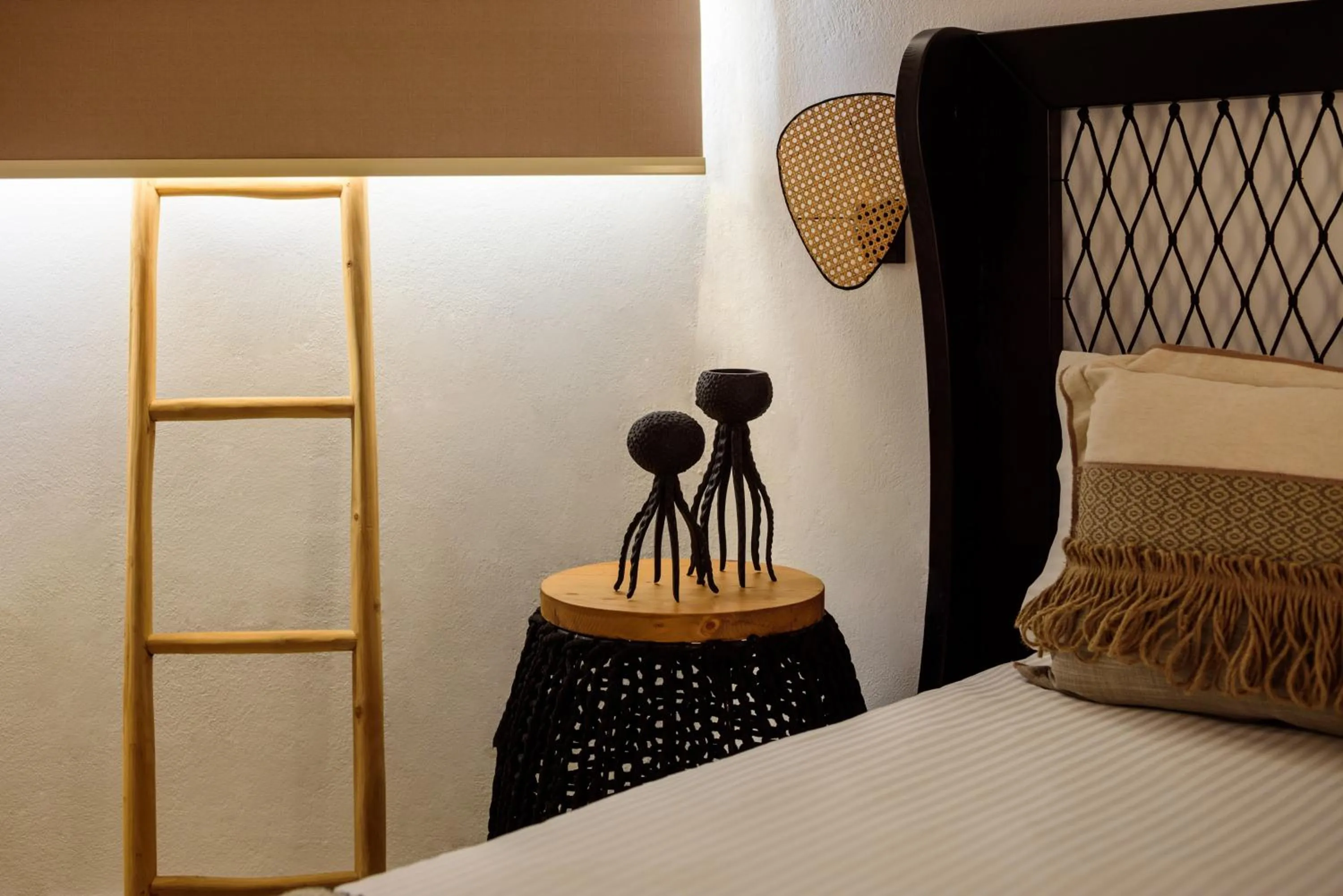 Decorative detail, Bed in Vrachos Suites Mykonos