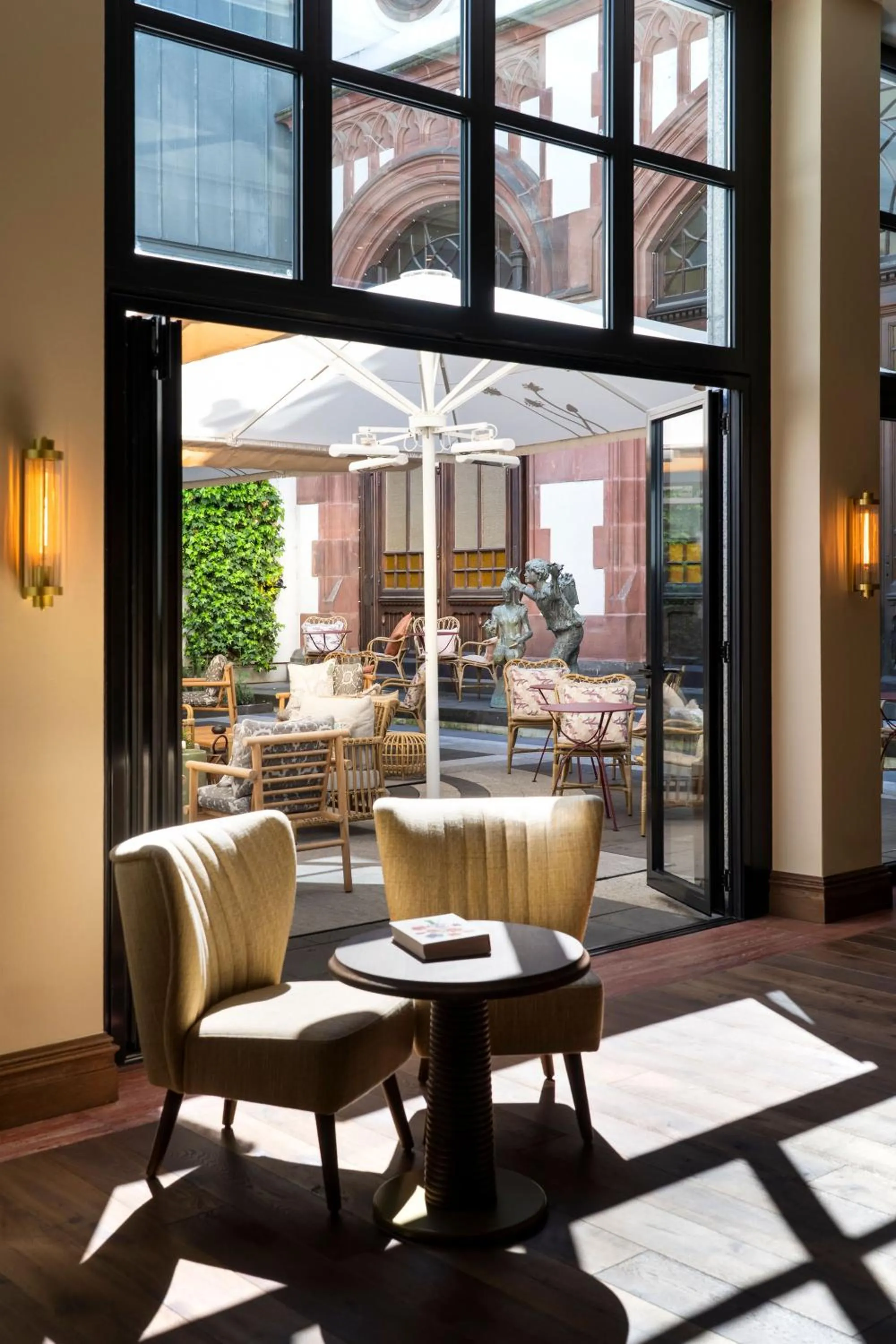 Inner courtyard view in Brunfels Hotel, in the Unbound Collection by Hyatt