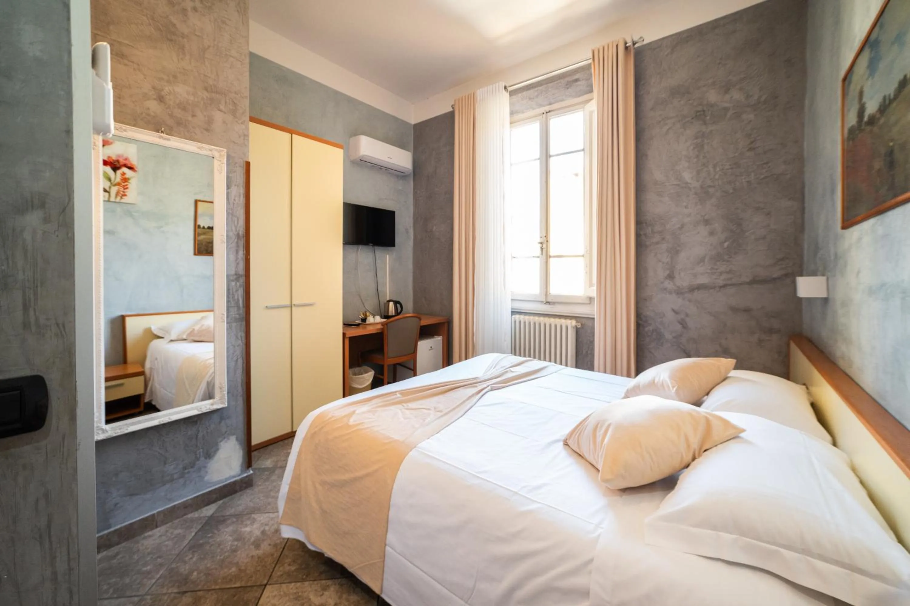 Bed in Hotel Angelica Firenze