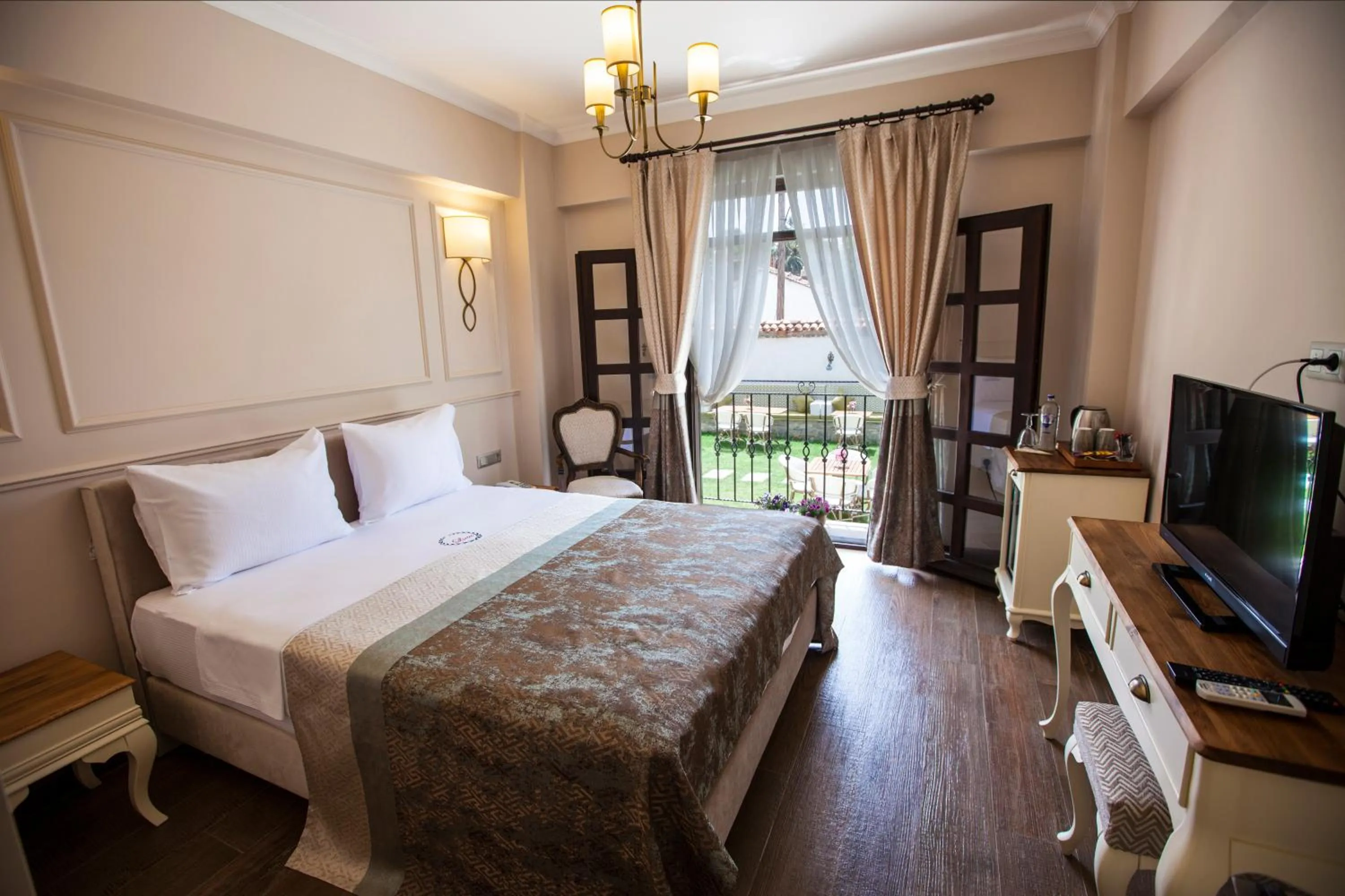 Bed in Livia Garden Hotel