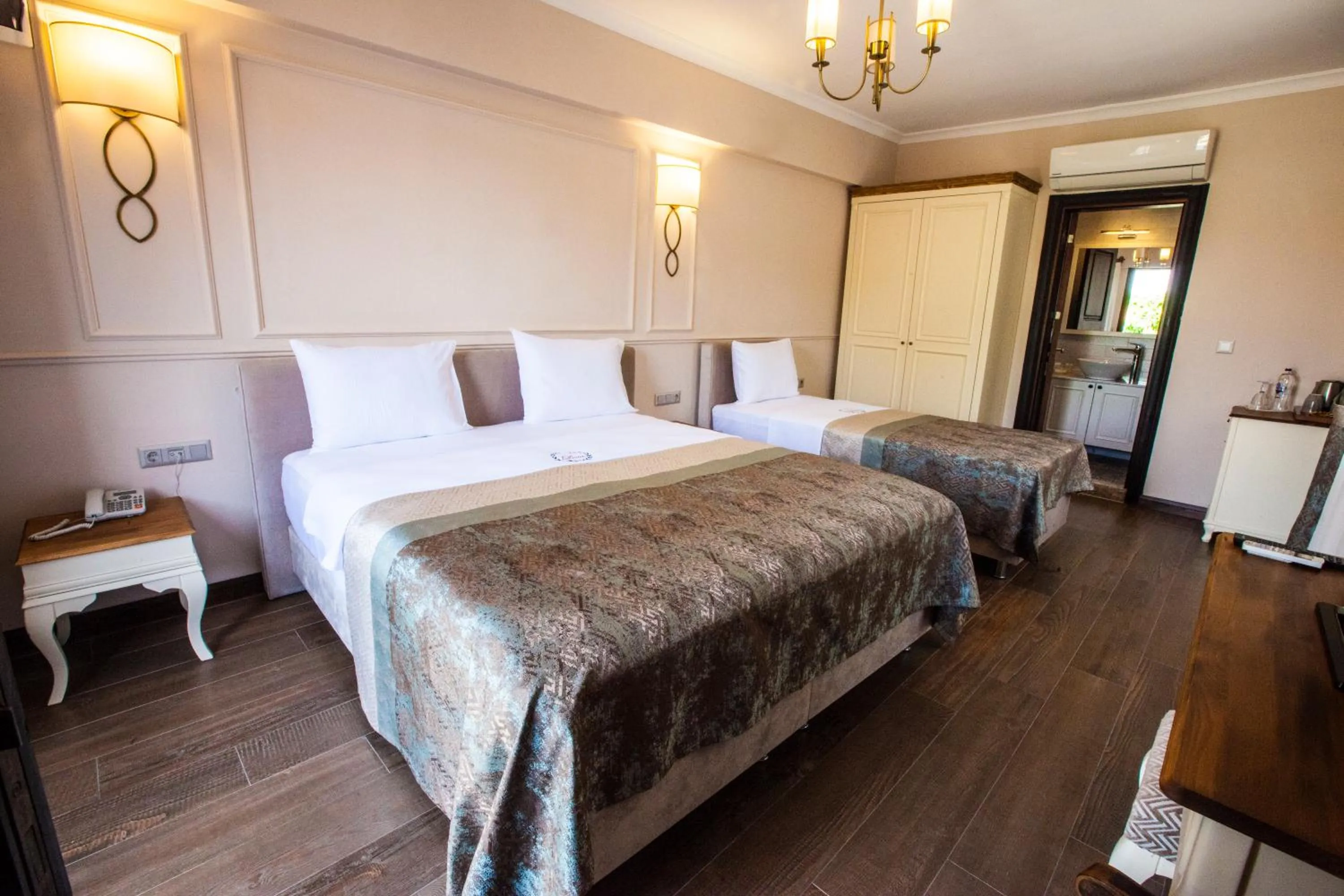 Bed in Livia Garden Hotel