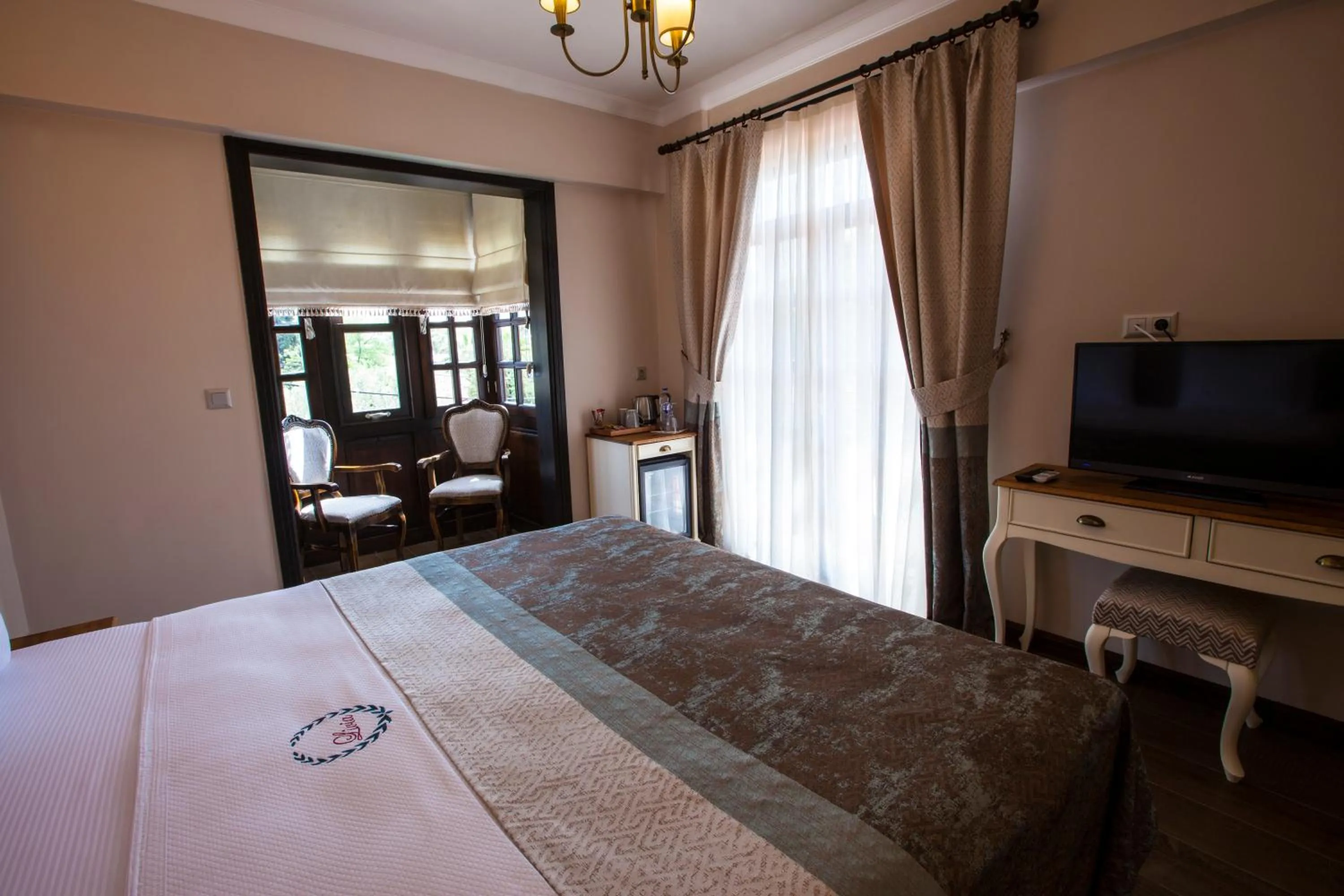 Bed in Livia Garden Hotel