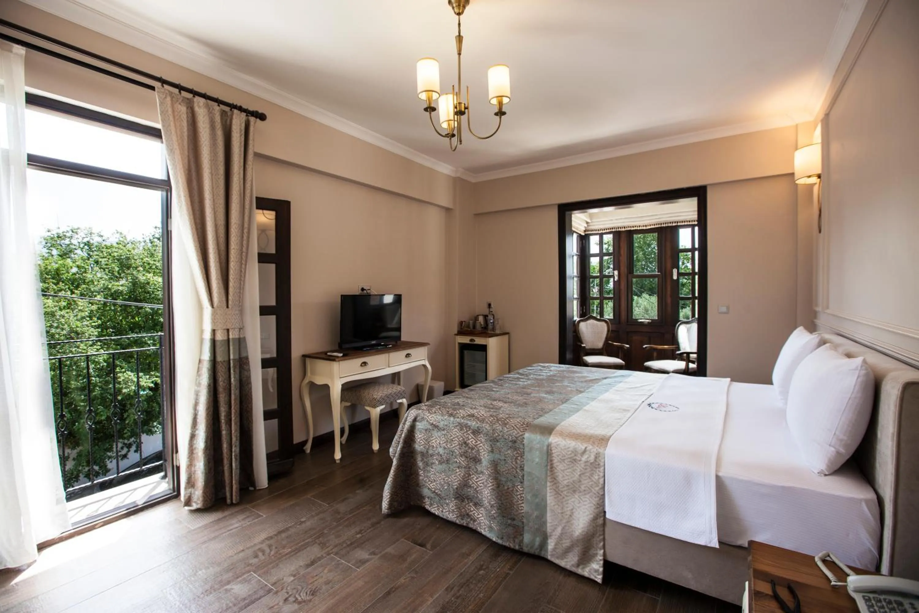 Bed in Livia Garden Hotel