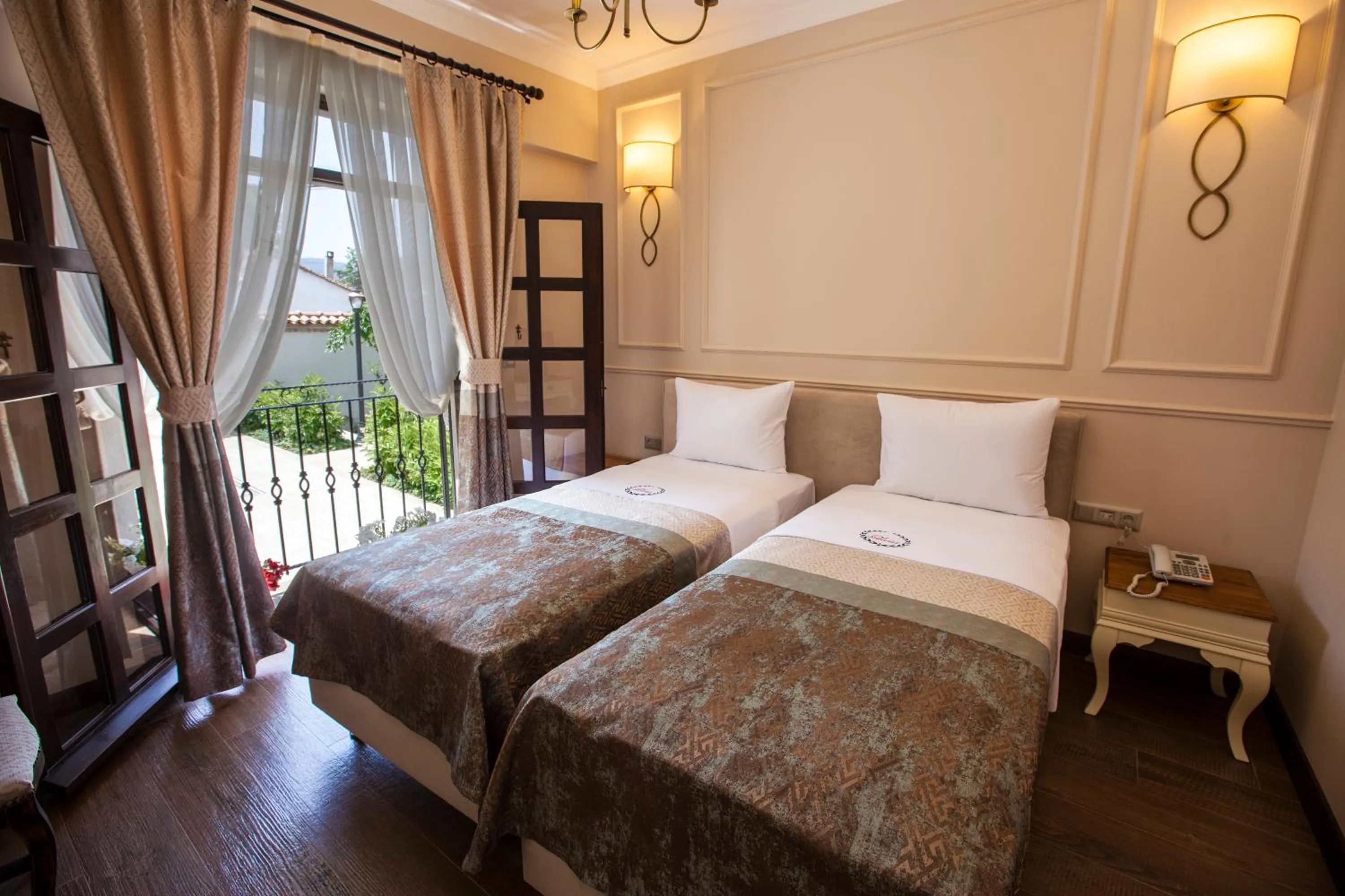 Bed in Livia Garden Hotel