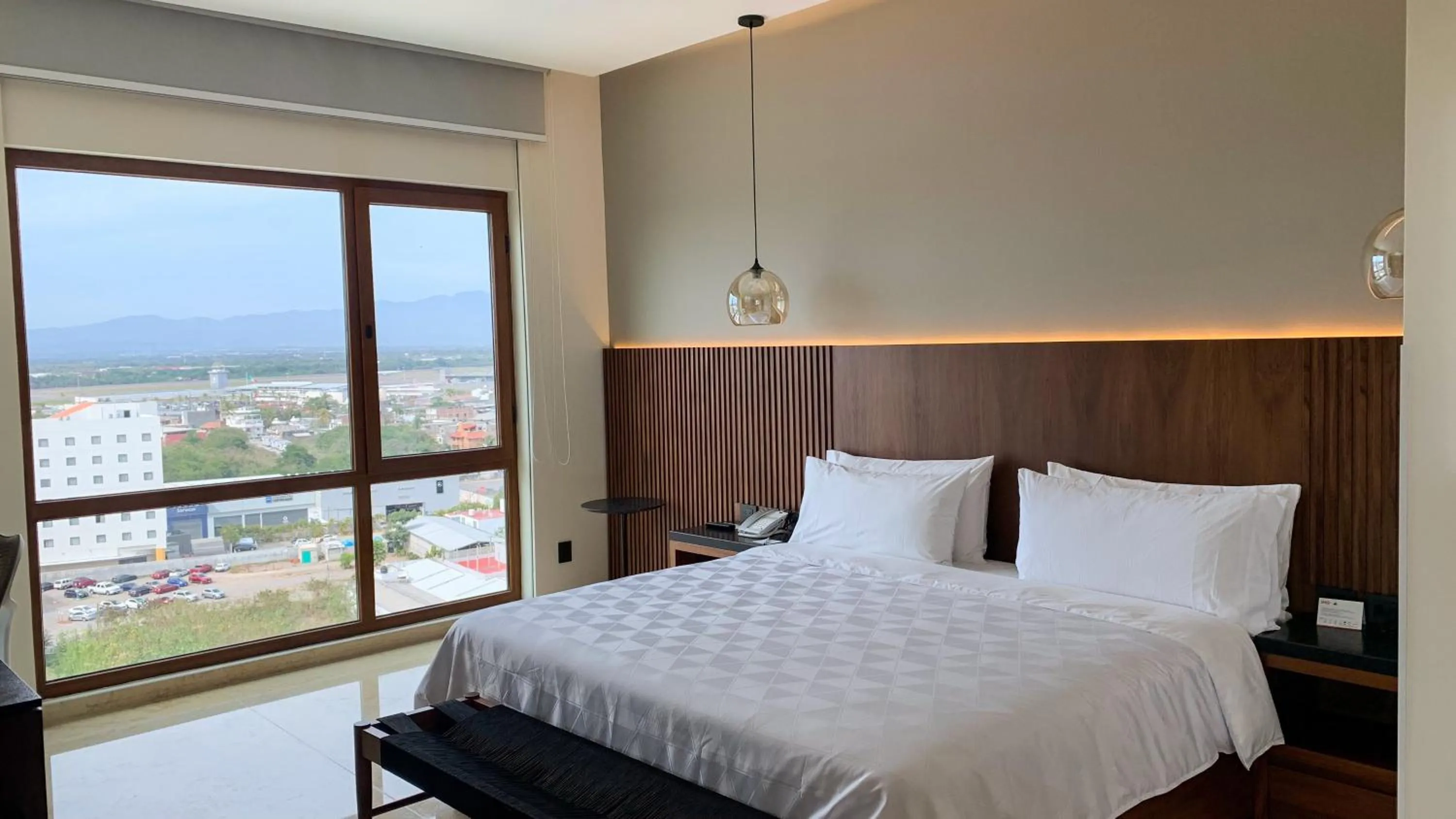 Photo of the whole room, Bed in Holiday Inn & Suites - Puerto Vallarta Marina & Golf by IHG