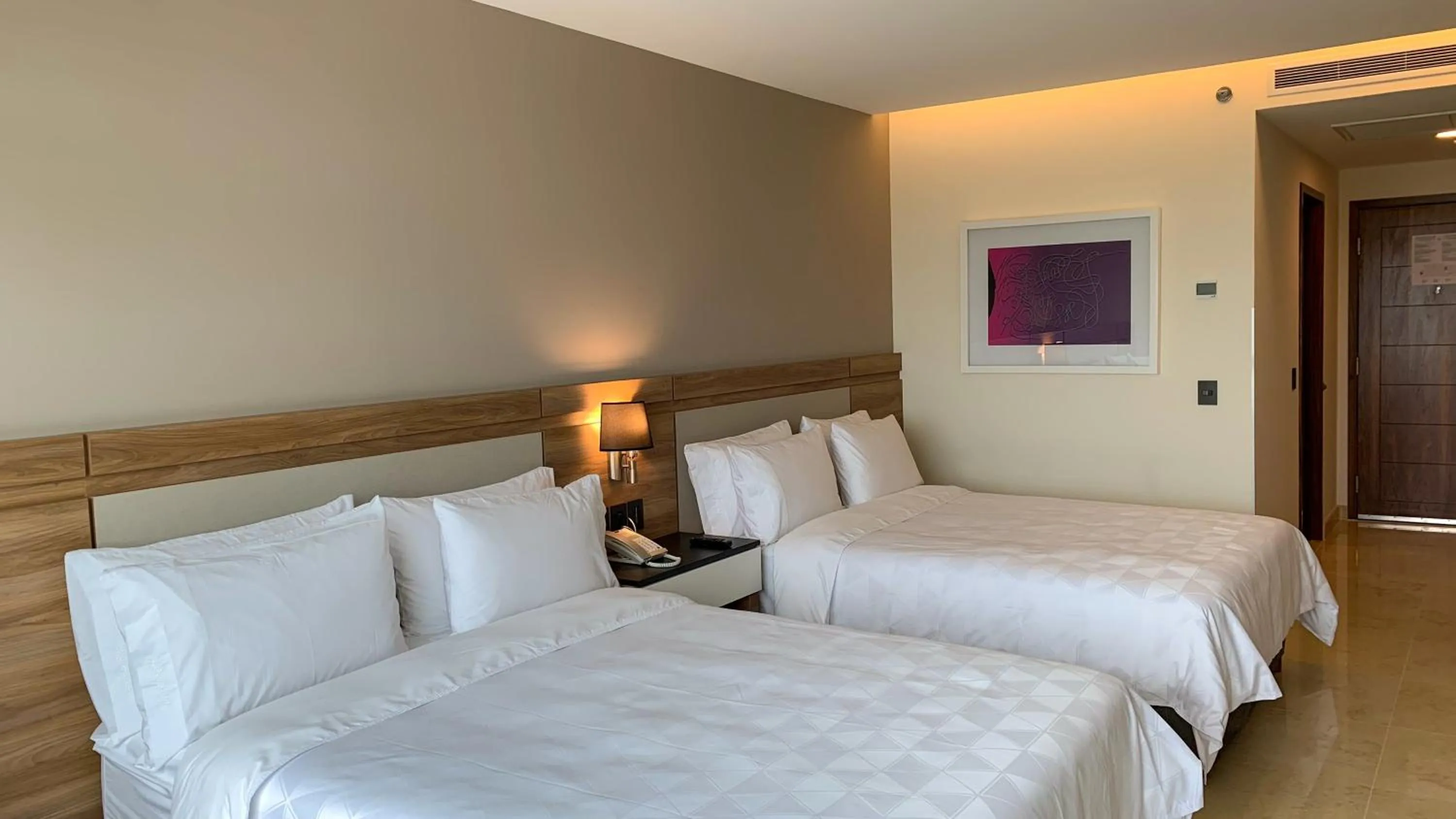 Photo of the whole room, Bed in Holiday Inn & Suites - Puerto Vallarta Marina & Golf by IHG