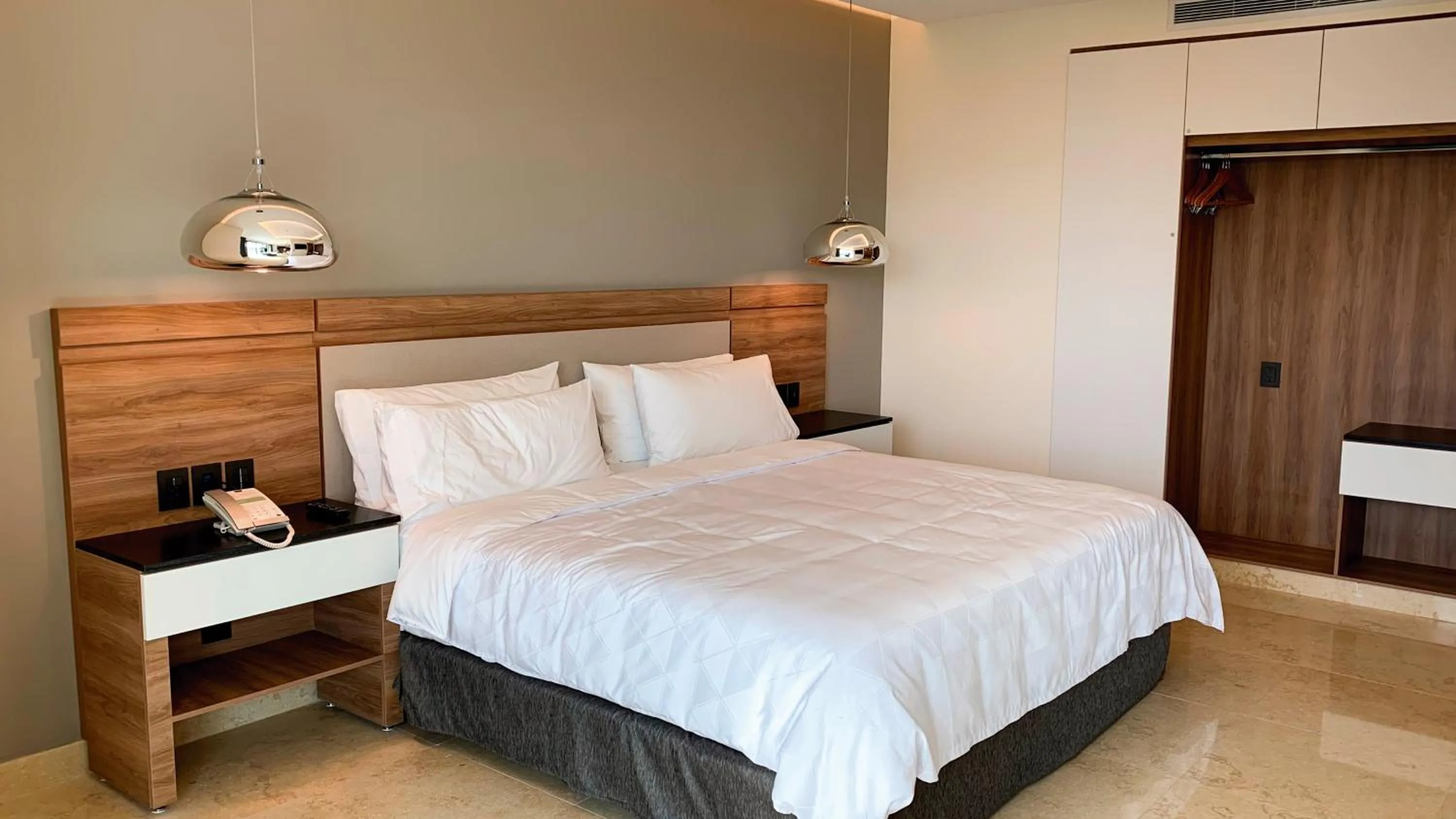 Photo of the whole room, Bed in Holiday Inn & Suites - Puerto Vallarta Marina & Golf by IHG