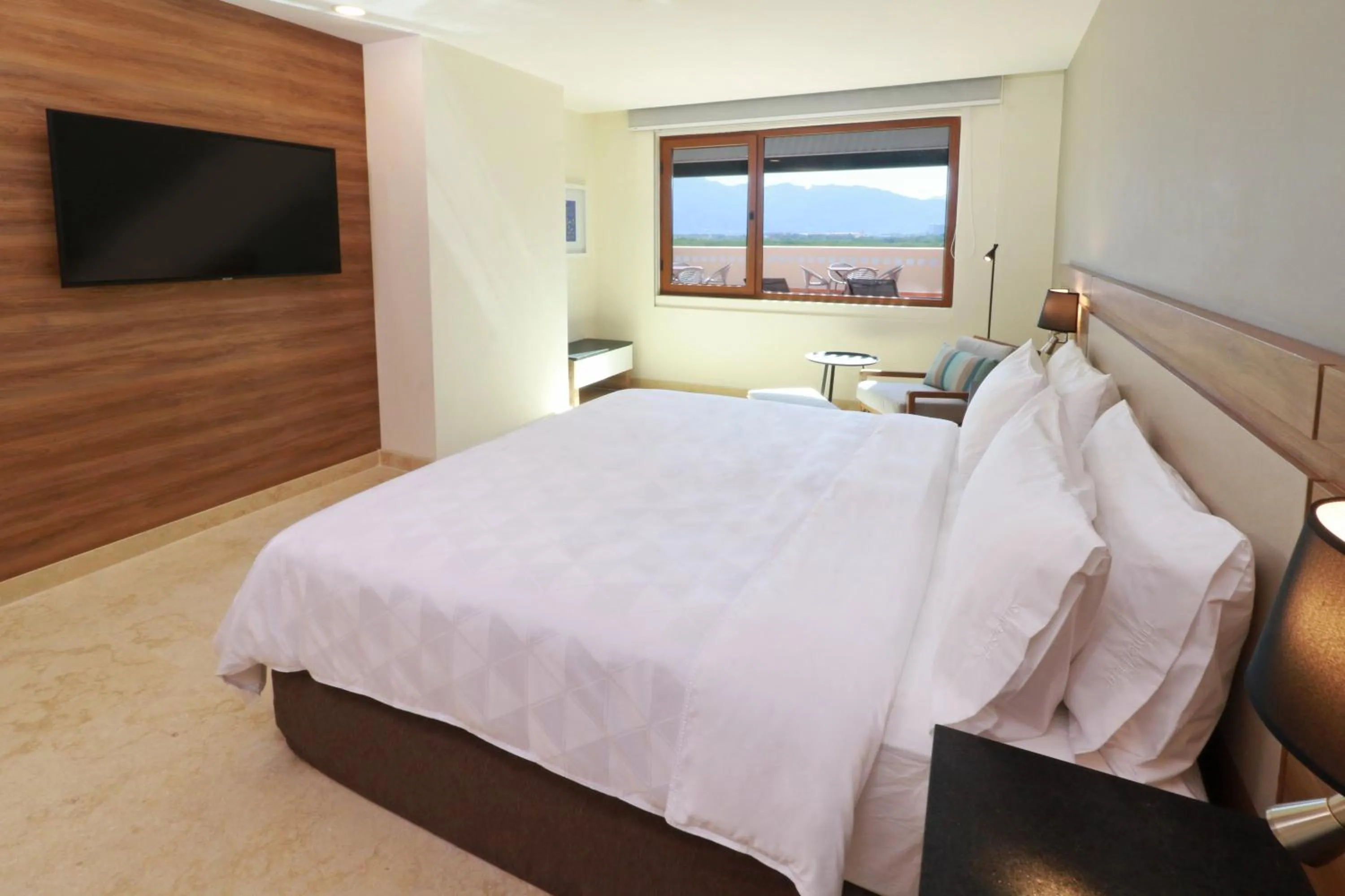 Photo of the whole room, Bed in Holiday Inn & Suites - Puerto Vallarta Marina & Golf by IHG