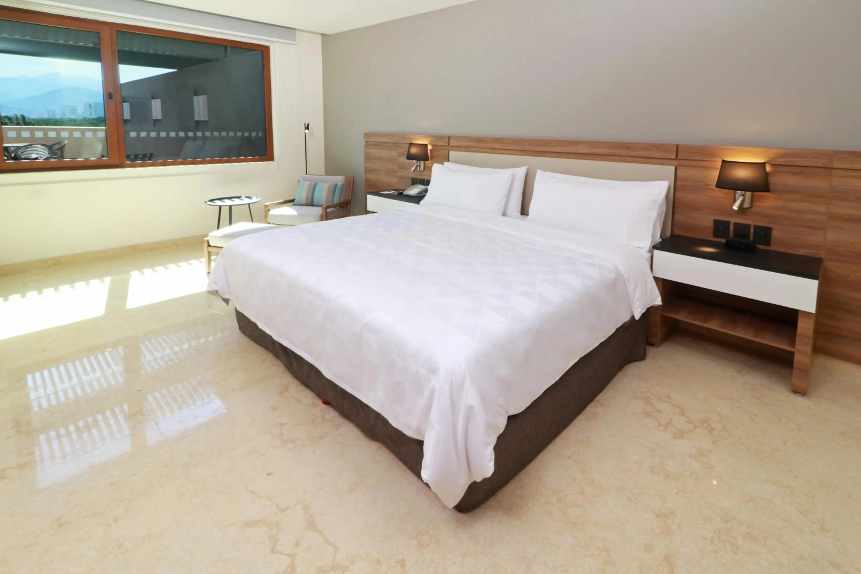 Photo of the whole room, Bed in Holiday Inn & Suites - Puerto Vallarta Marina & Golf by IHG