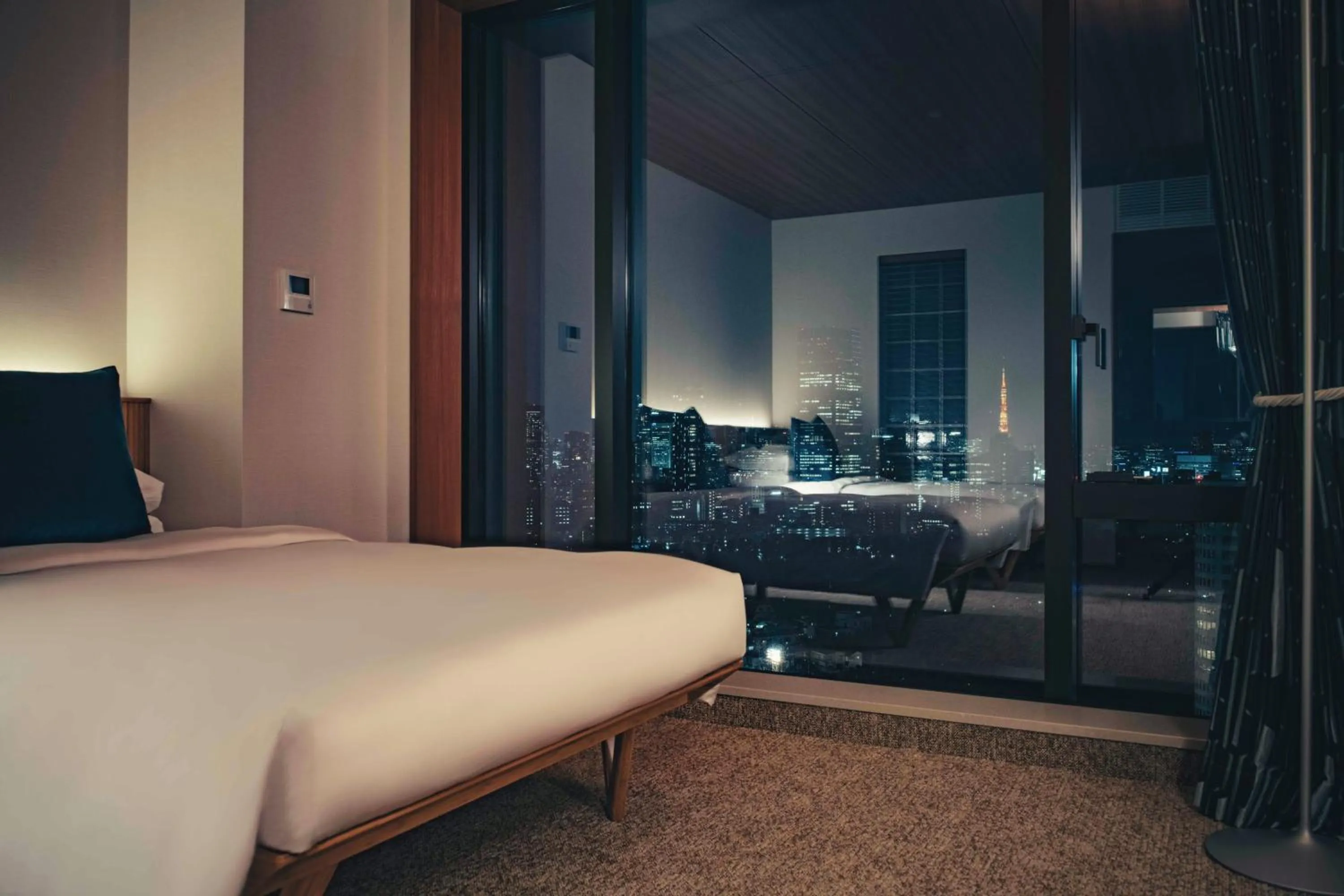 Bed in THE AOYAMA GRAND HOTEL