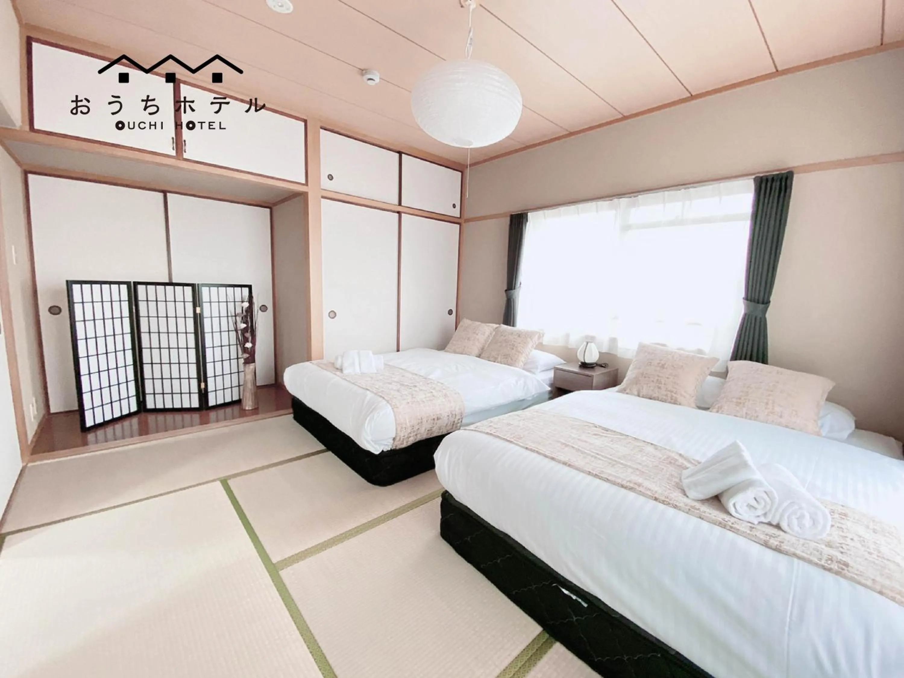 Bed in OUCHI HOTEL Itsukaichi