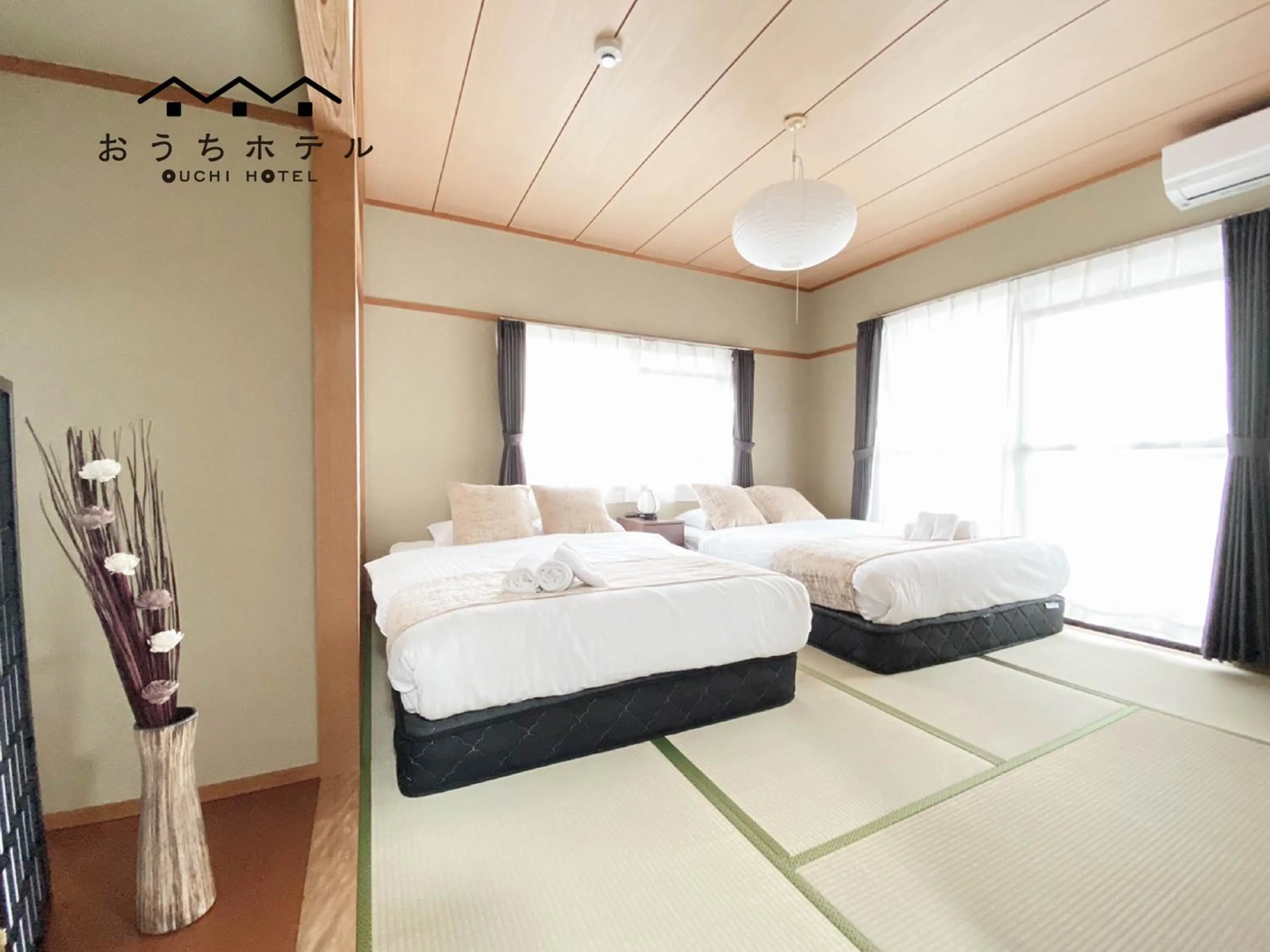 Bed in OUCHI HOTEL Itsukaichi