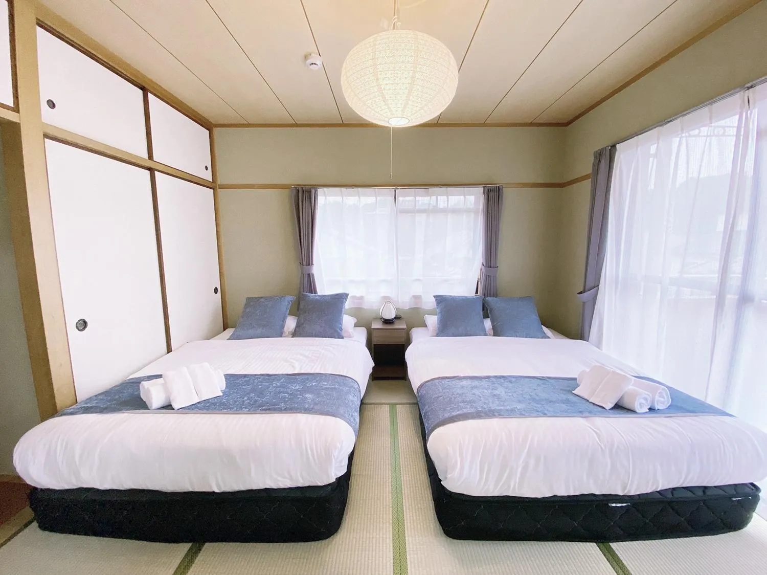 Bed in OUCHI HOTEL Itsukaichi