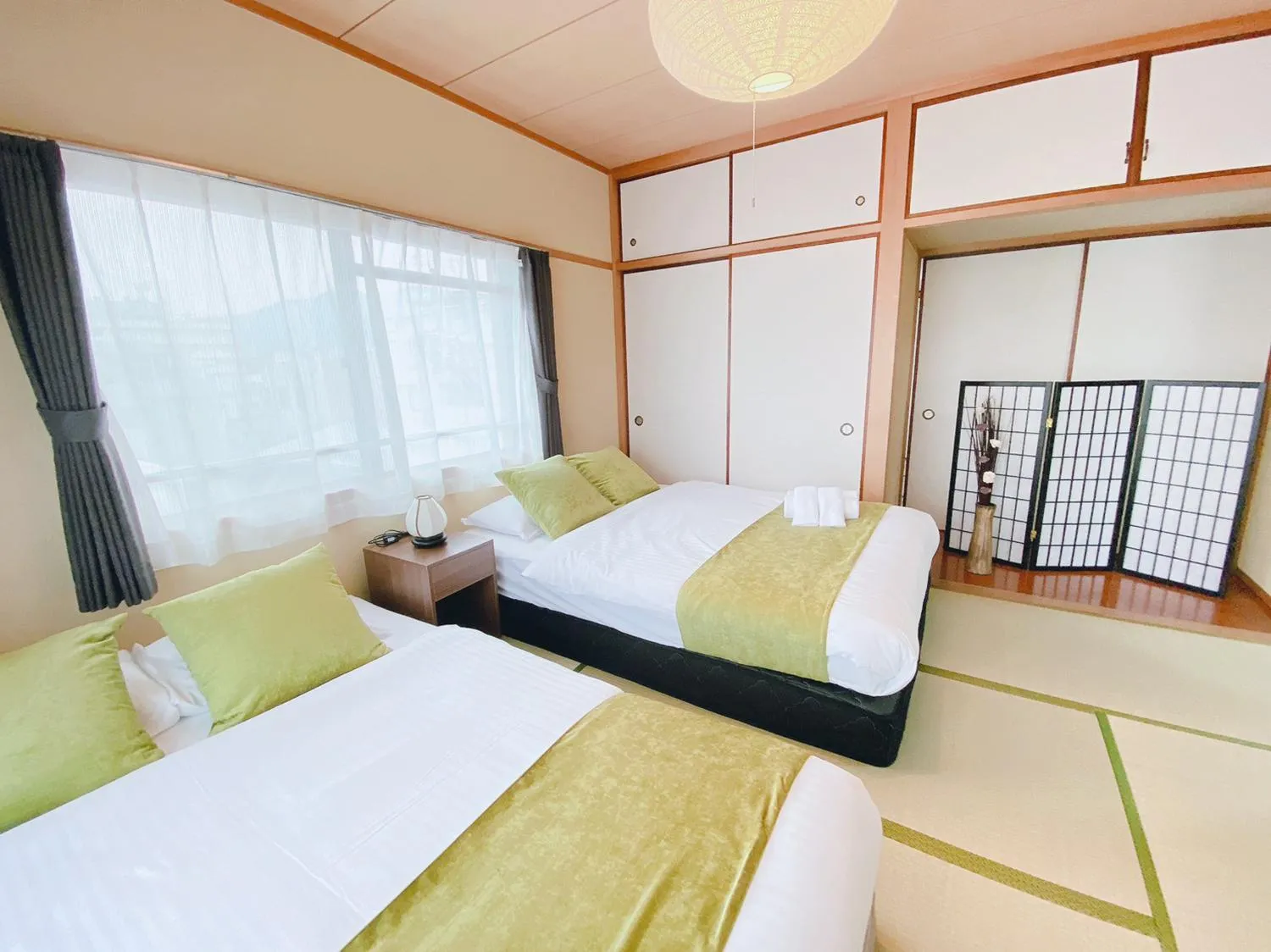 Bed in OUCHI HOTEL Itsukaichi