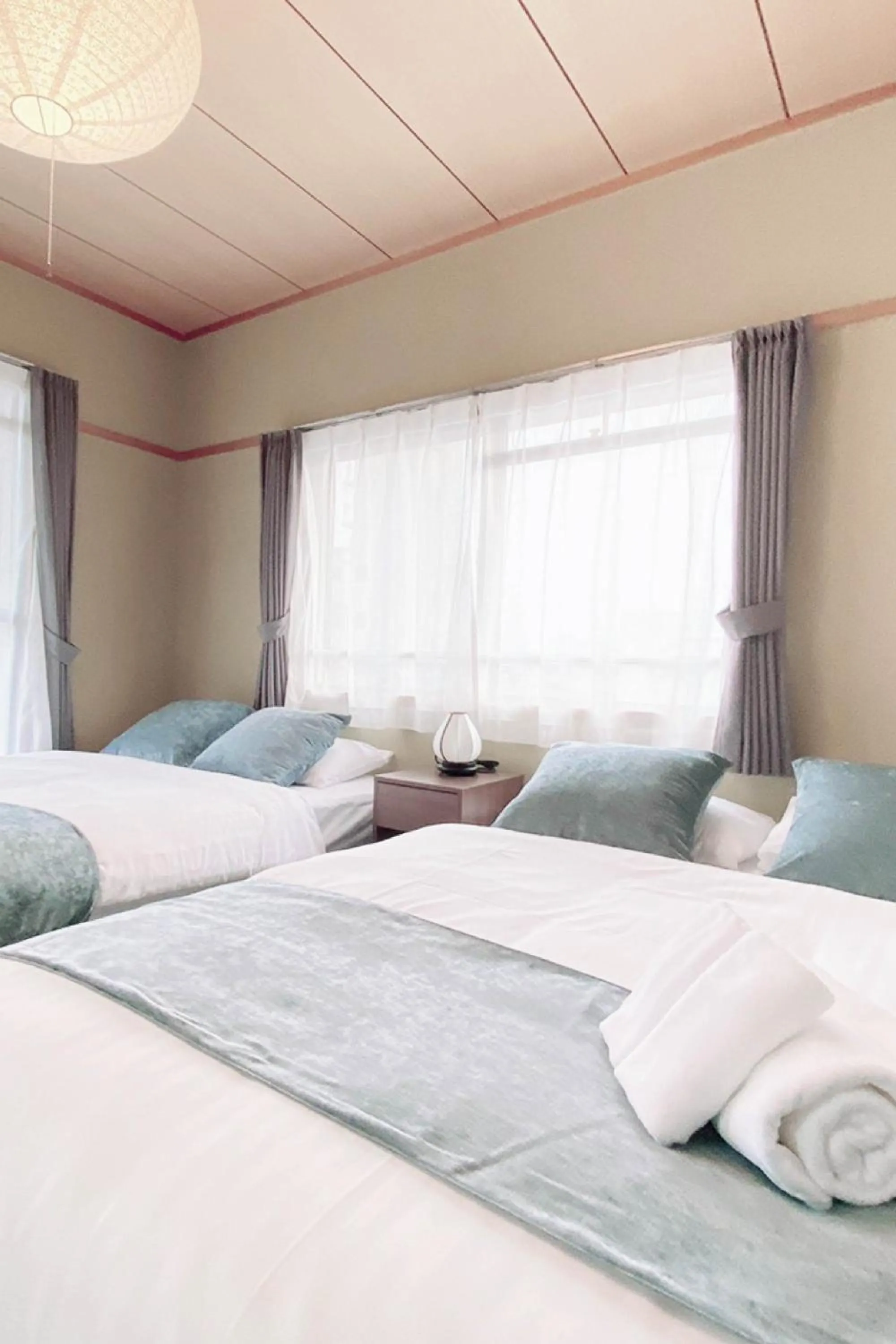 Bed in OUCHI HOTEL Itsukaichi