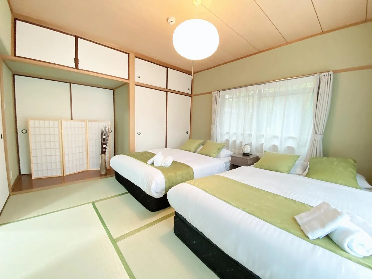 Bed in OUCHI HOTEL Itsukaichi
