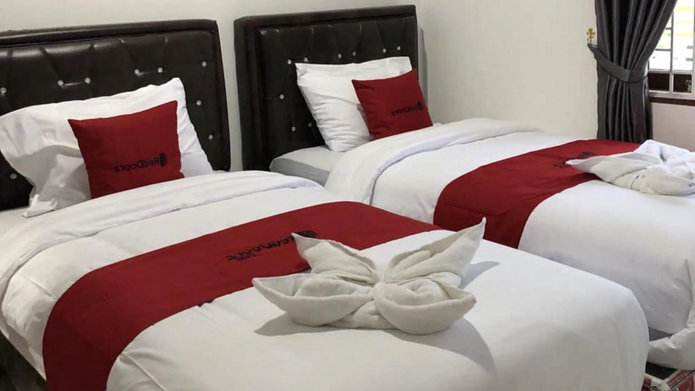 Bed in RedDoorz near CitraLand Gama City Medan